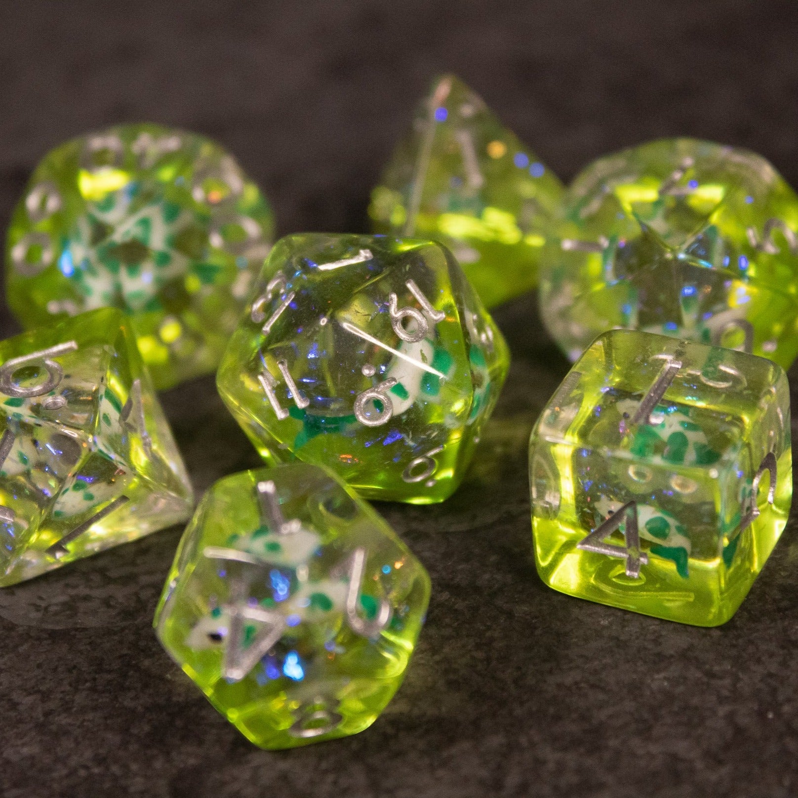 Green Koi Fish Dice Set - Green translucent polyhedral dice set with tiny koi fish inclusions and white numbering.