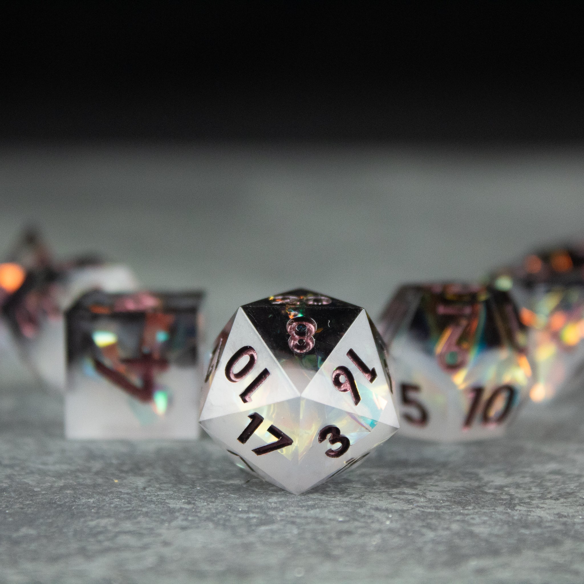 Oathbreaker Dice Set - Black and white sharp-edged premium polyhedral dice with gold numbering.