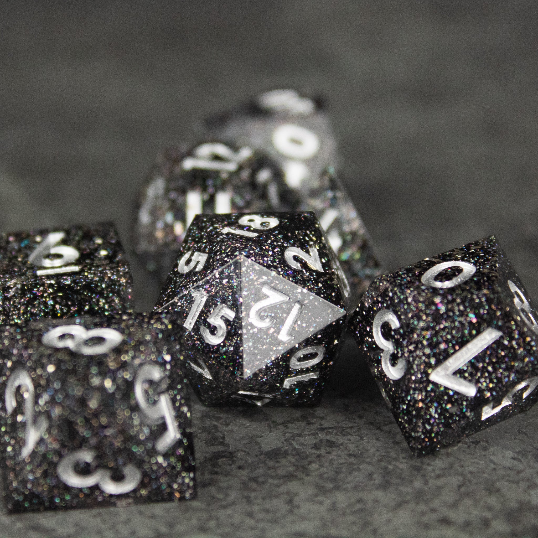 Starfield Dice Set - Black glittery polyhedral dice set with sharp edges and white numbering for tabletop gaming.