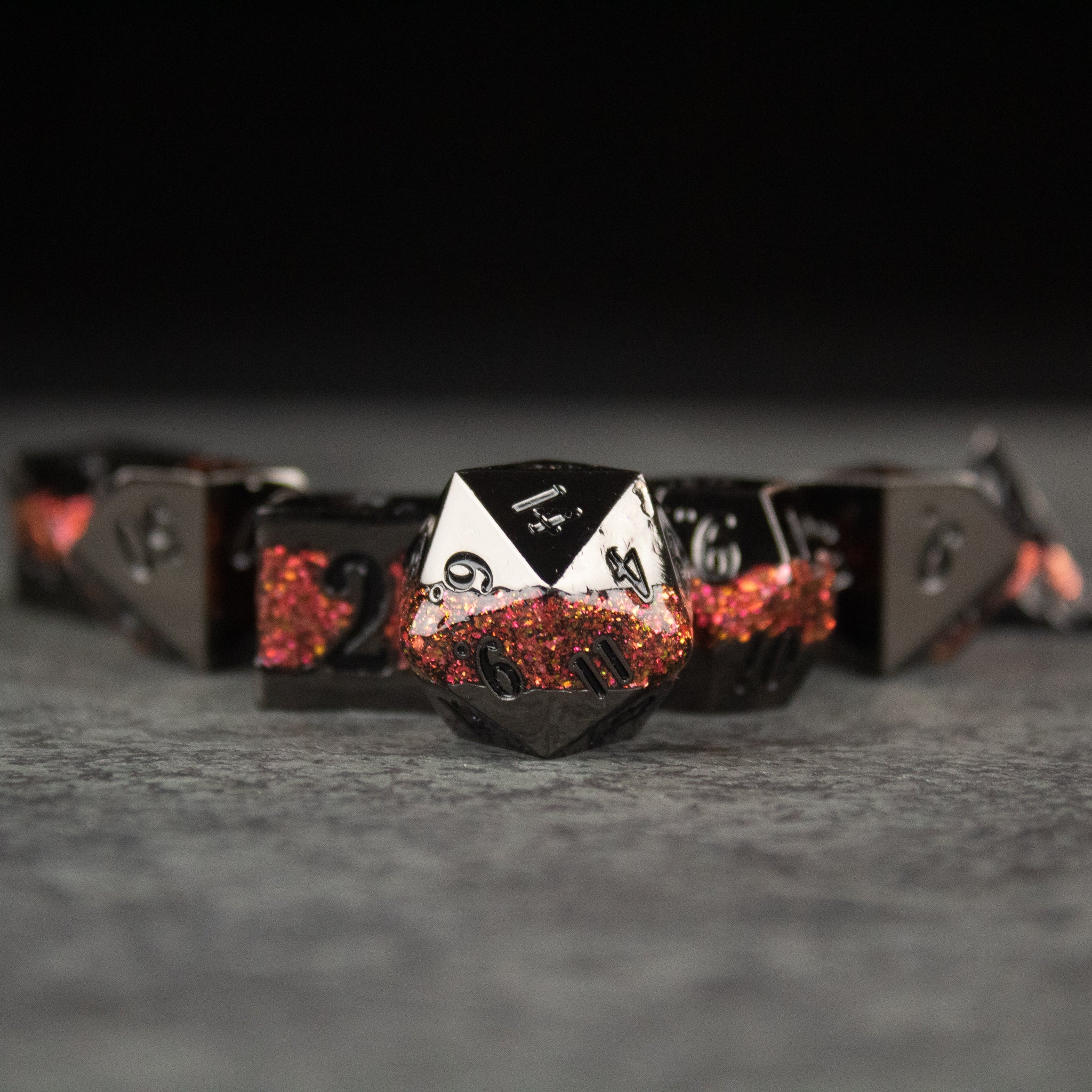 Red Rift Metal Dice Set - Metal polyhedral dice set with red and black rift design, sharp edges, and white numbering.