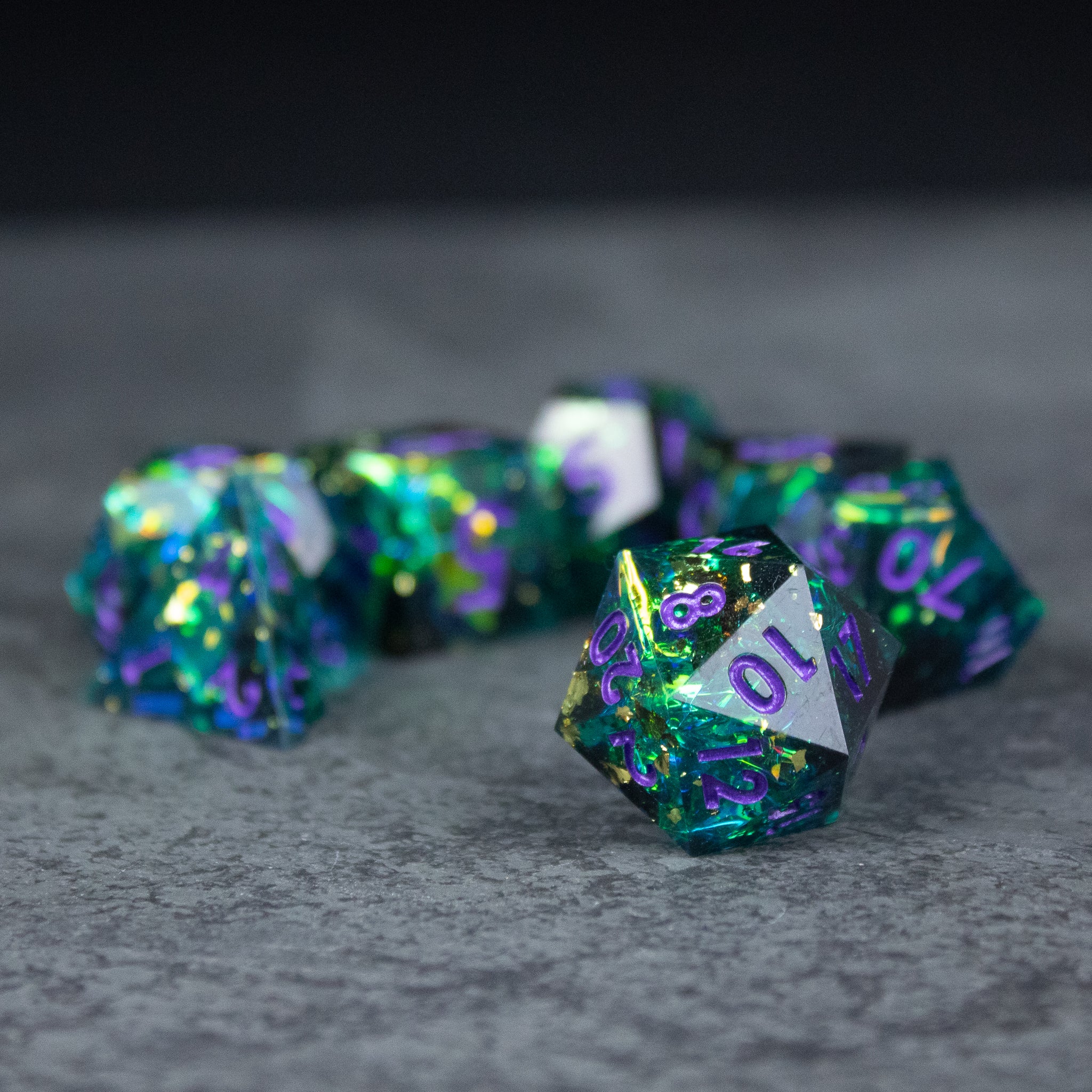 Deathblight Dice Set - Blue and green sharp-edged necromancer-themed polyhedral dice set with purple numbers.