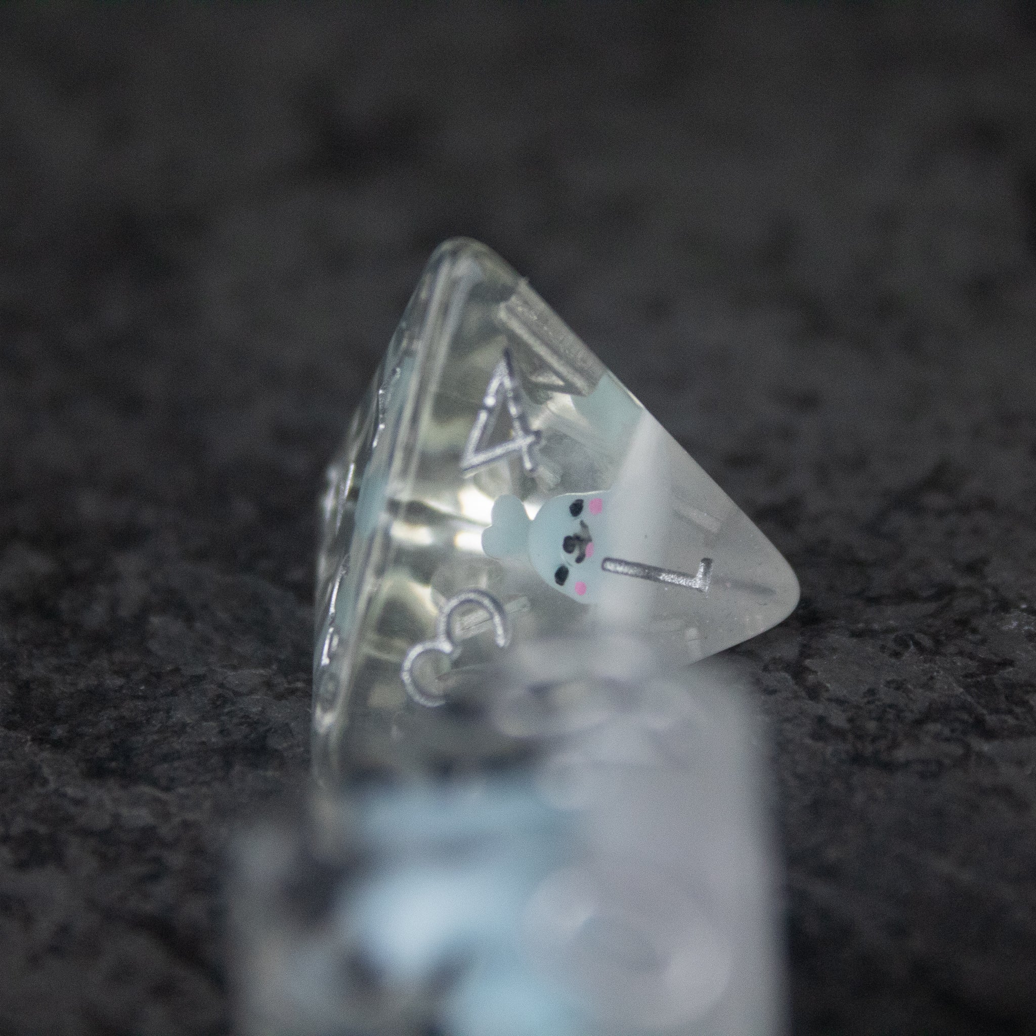 Blue Seal Dice Set - Translucent blue four-sided dice with white numbers and a small seal illustration on one face.