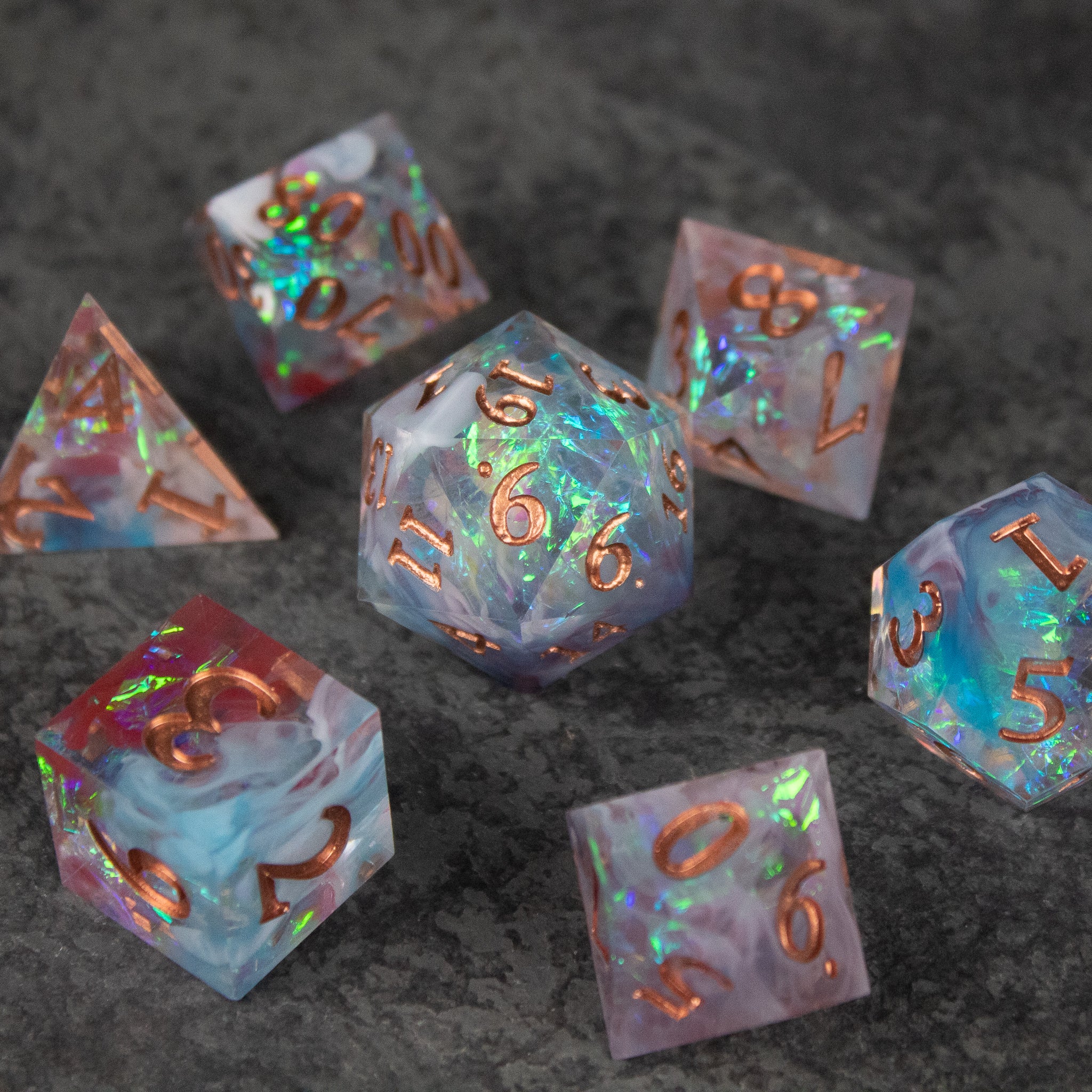 Divination Dice Set - Set of seven translucent d4 to d20 dice with sharp edges, holographic glitter, and rose gold numbers.