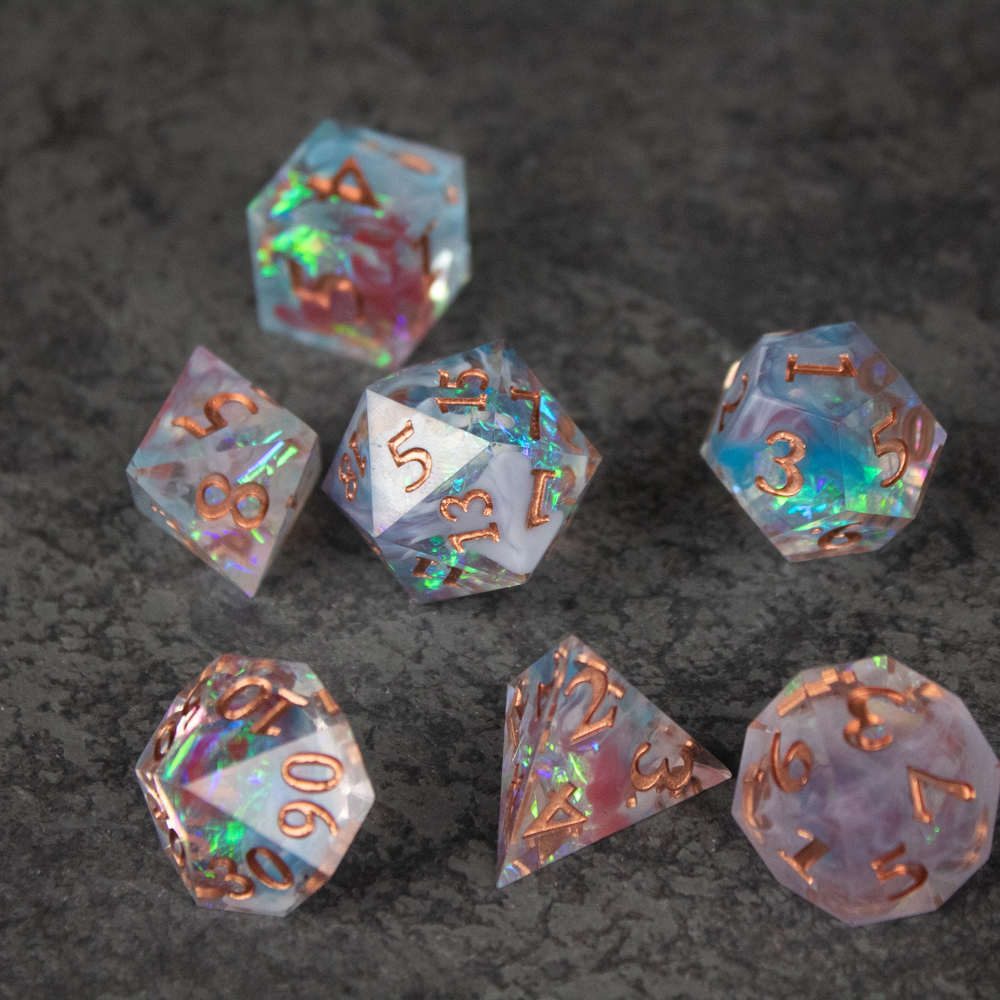 Divination Dice Set - Translucent purple sharp-edged polyhedral dice set with gold numbers and iridescent shimmer.