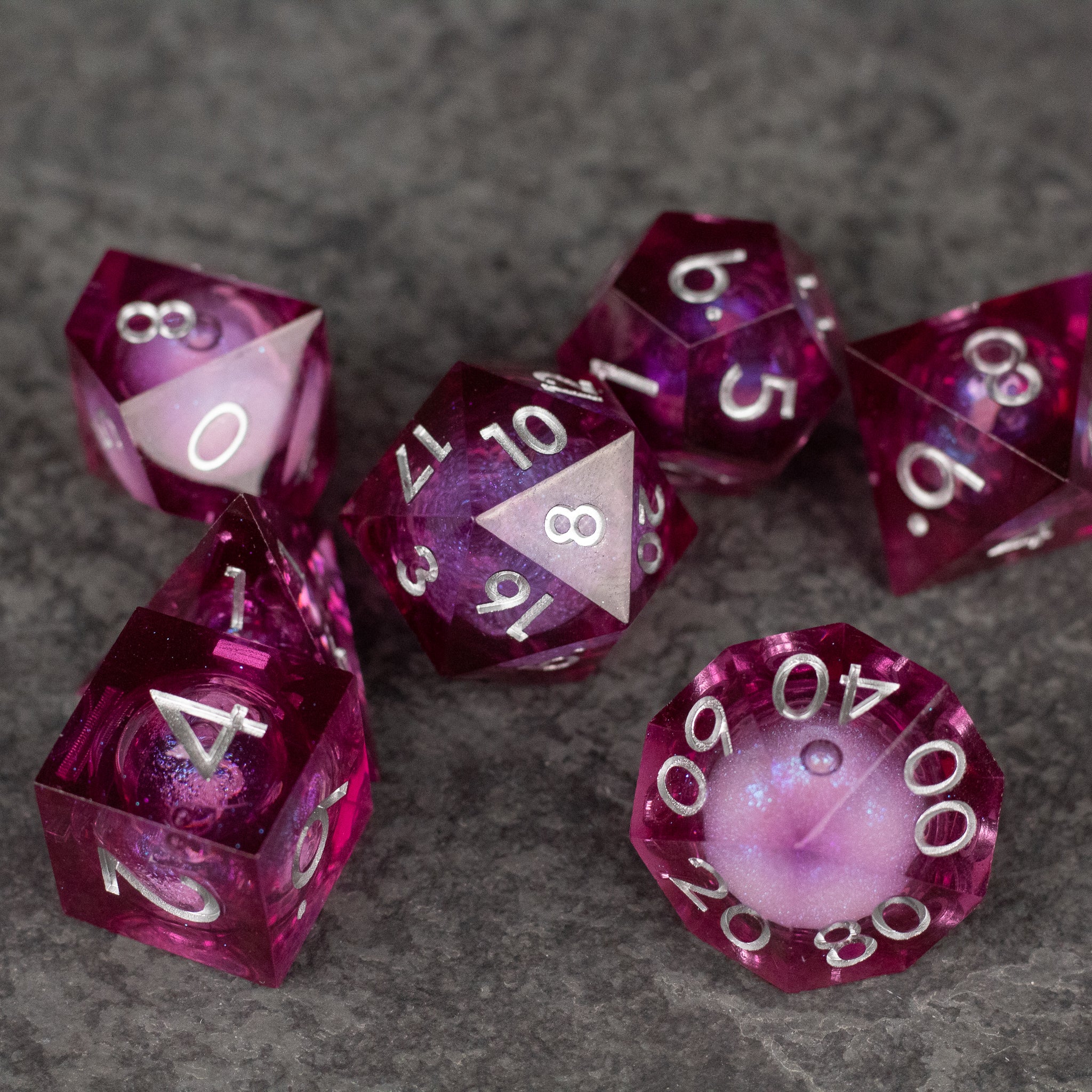 Magic Wine - Liquid Core Dice Set - Set of seven deep red translucent polyhedral dice with sharp edges and liquid core, white numbering.