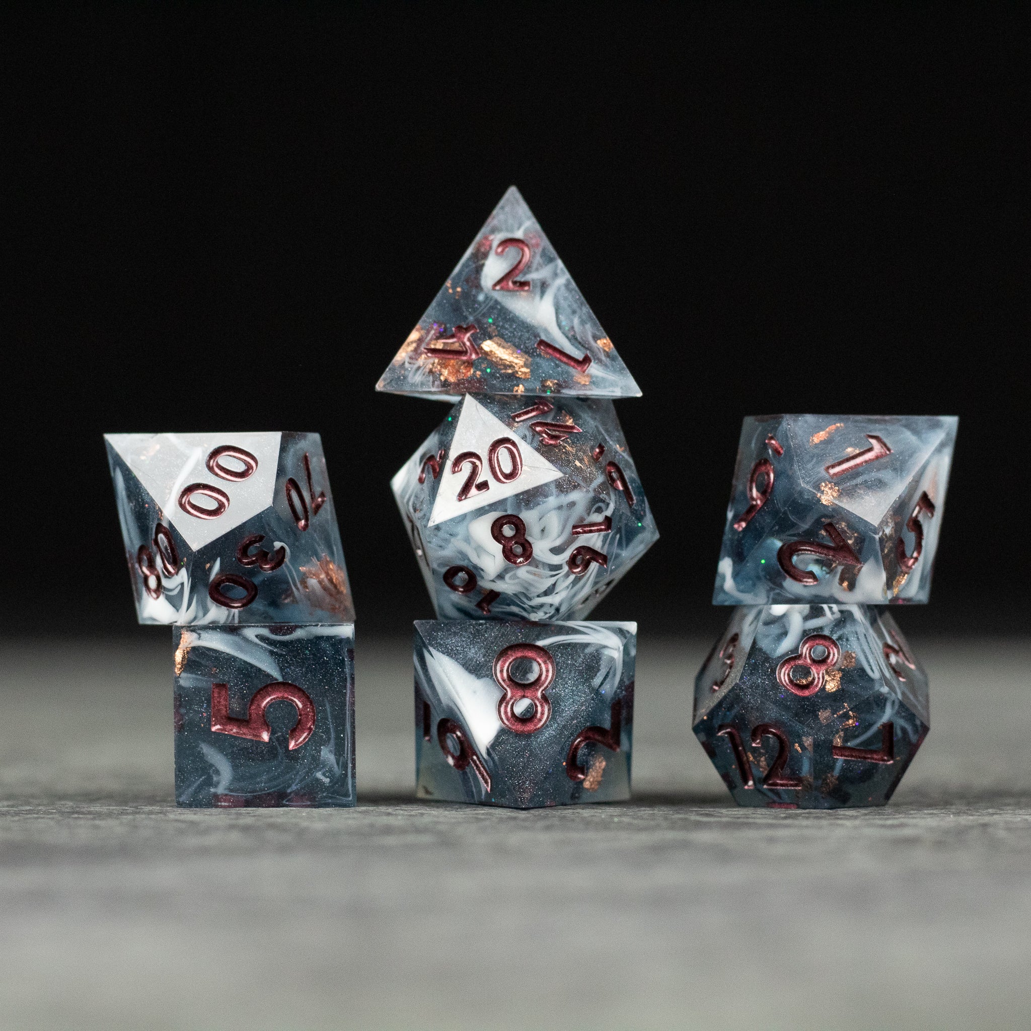 Omen Dice Set - Black and gray marbled sharp-edged dice set with red numbering, including d4, d6, d8, d10, d12, and d20.