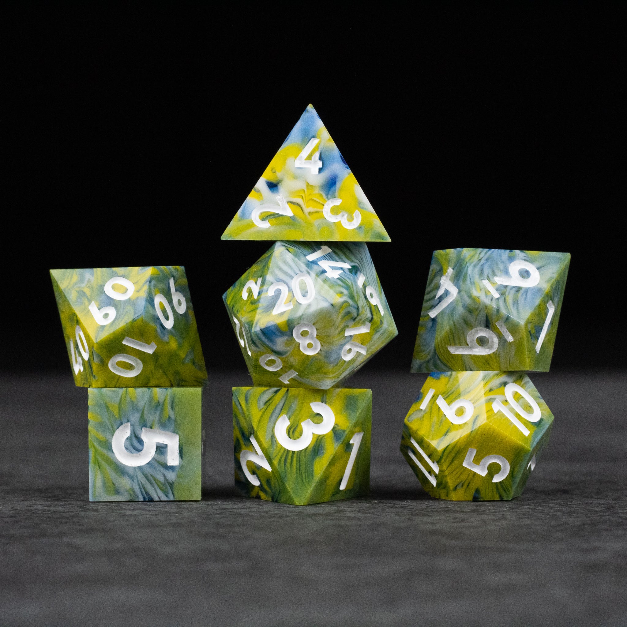 Acid Splash Dice Set - Set of six sharp-edged polyhedral dice in green, yellow, and blue with white numbering.