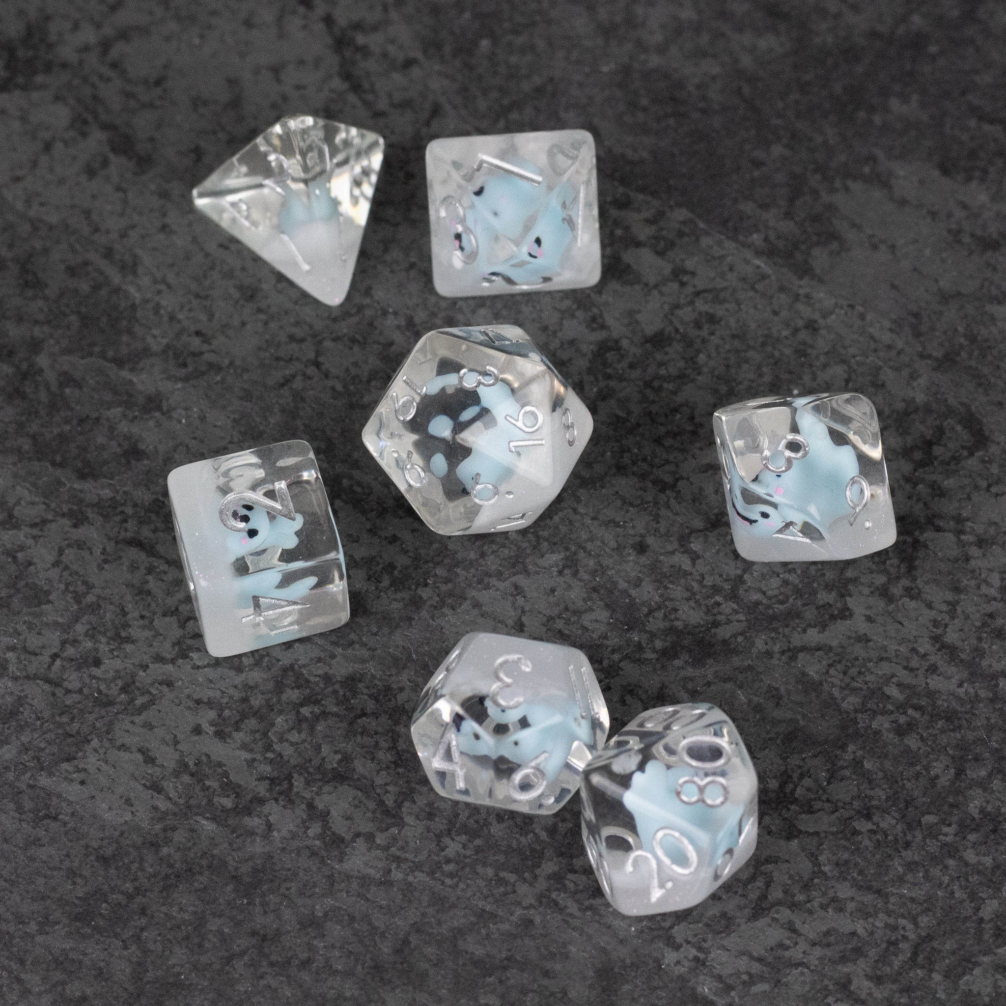 Blue Seal Dice Set - Clear polyhedral dice set with blue seal illustrations inside, featuring multiple shapes.