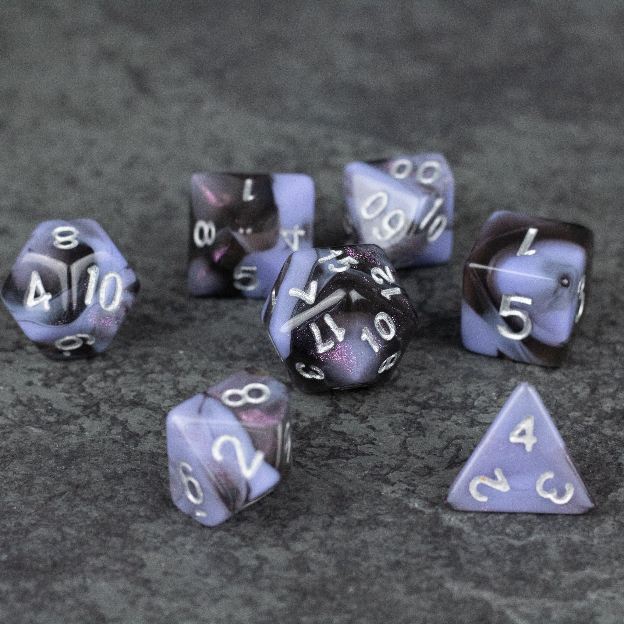 Periwinkle and Black Marbled Dice Set - Periwinkle and black marbled acrylic dice set with white numbering, including multiple polyhedral shapes.