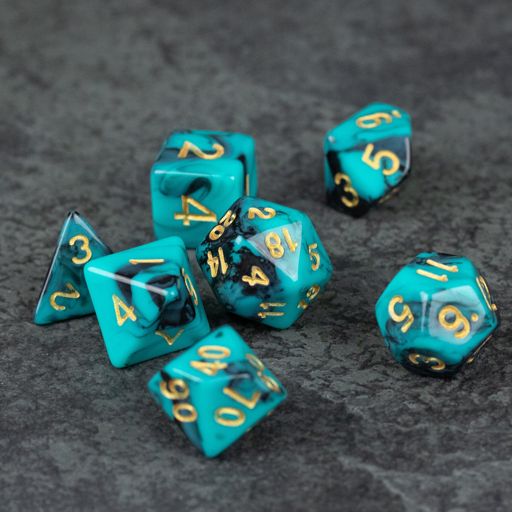 Mint and Black Marbled Dice Set - Set of seven mint and black marbled acrylic dice with gold numbers, including d4, d6, d8, d10, d12, and d20 shapes.
