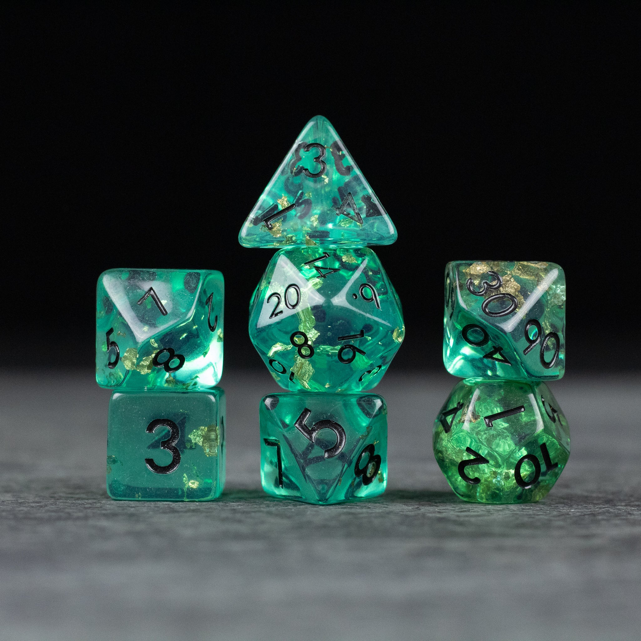 Teal Foil Dice Set - Teal foil polyhedral dice set with black numbers, including d20, d12, d10, d8, d6, and d4.