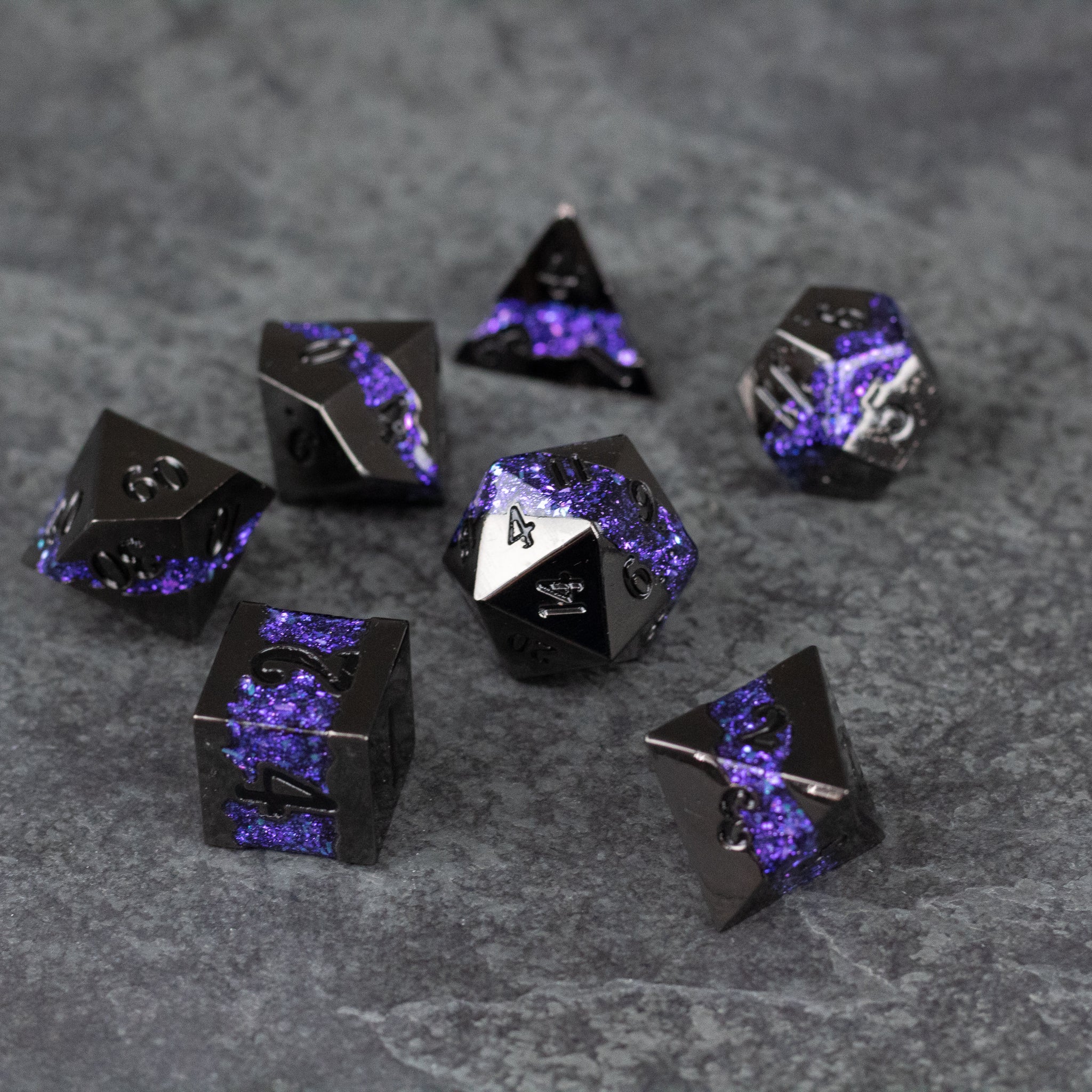Purple Rift Dice Set - Set of eight black metal polyhedral dice with vibrant purple marbled patterns and white numbers.