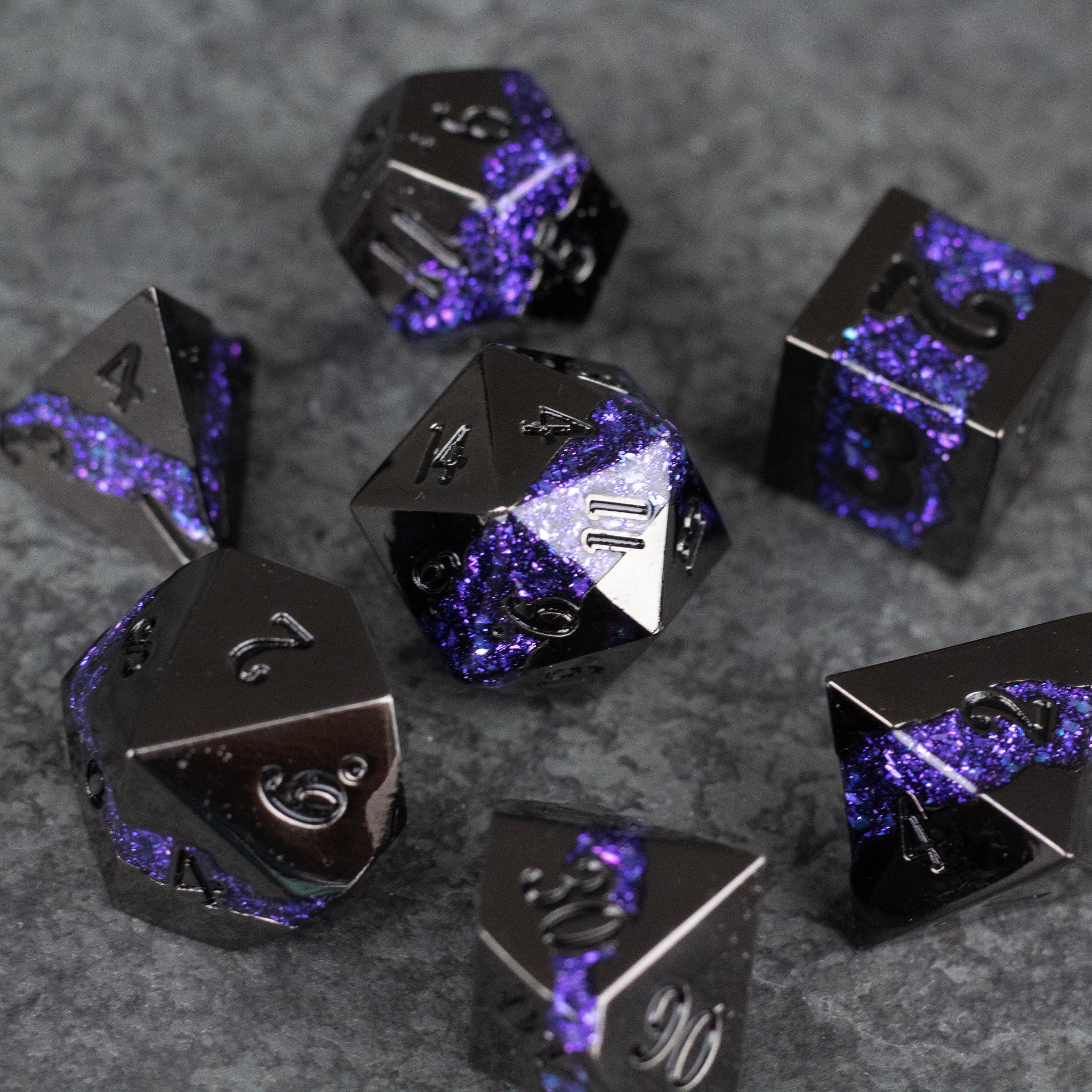 Purple Rift Dice Set - Black metal polyhedral dice set with vibrant purple marbled streaks and white numbering.