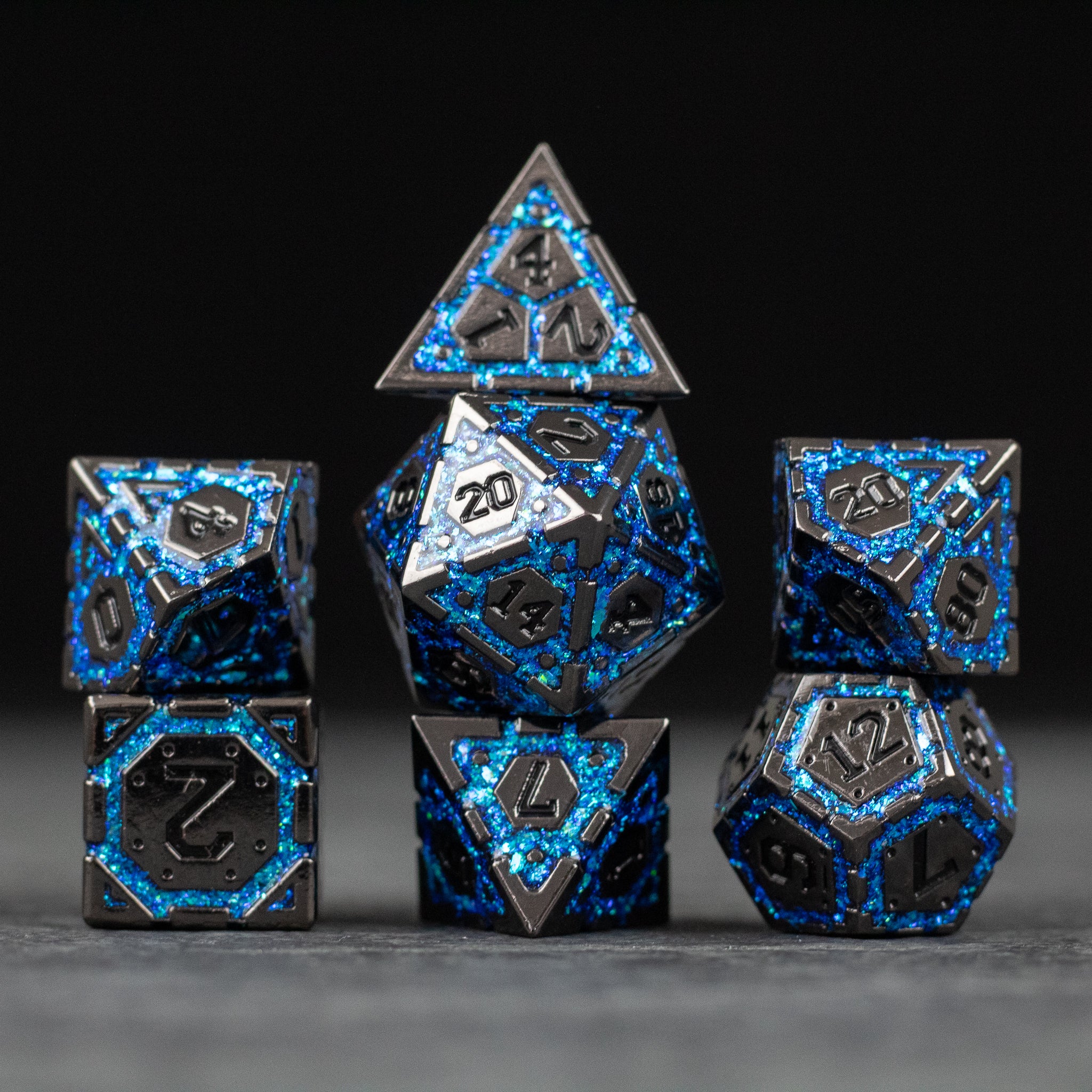 Blue Arcane Ward - Black metal dice set with glowing blue arcane patterns, featuring a 20-sided die showing the number 20.