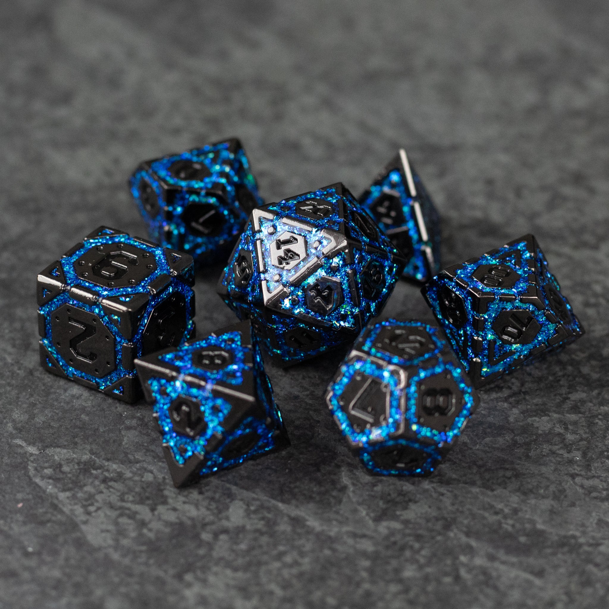 Blue Arcane Ward - Set of metal polyhedral dice in black with glowing blue arcane rune patterns for tabletop RPGs.