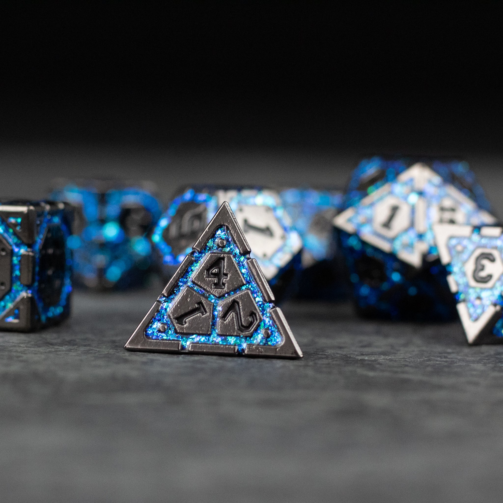 Blue Arcane Ward - Metal dice set featuring blue and black arcane-themed designs with intricate numbering details.