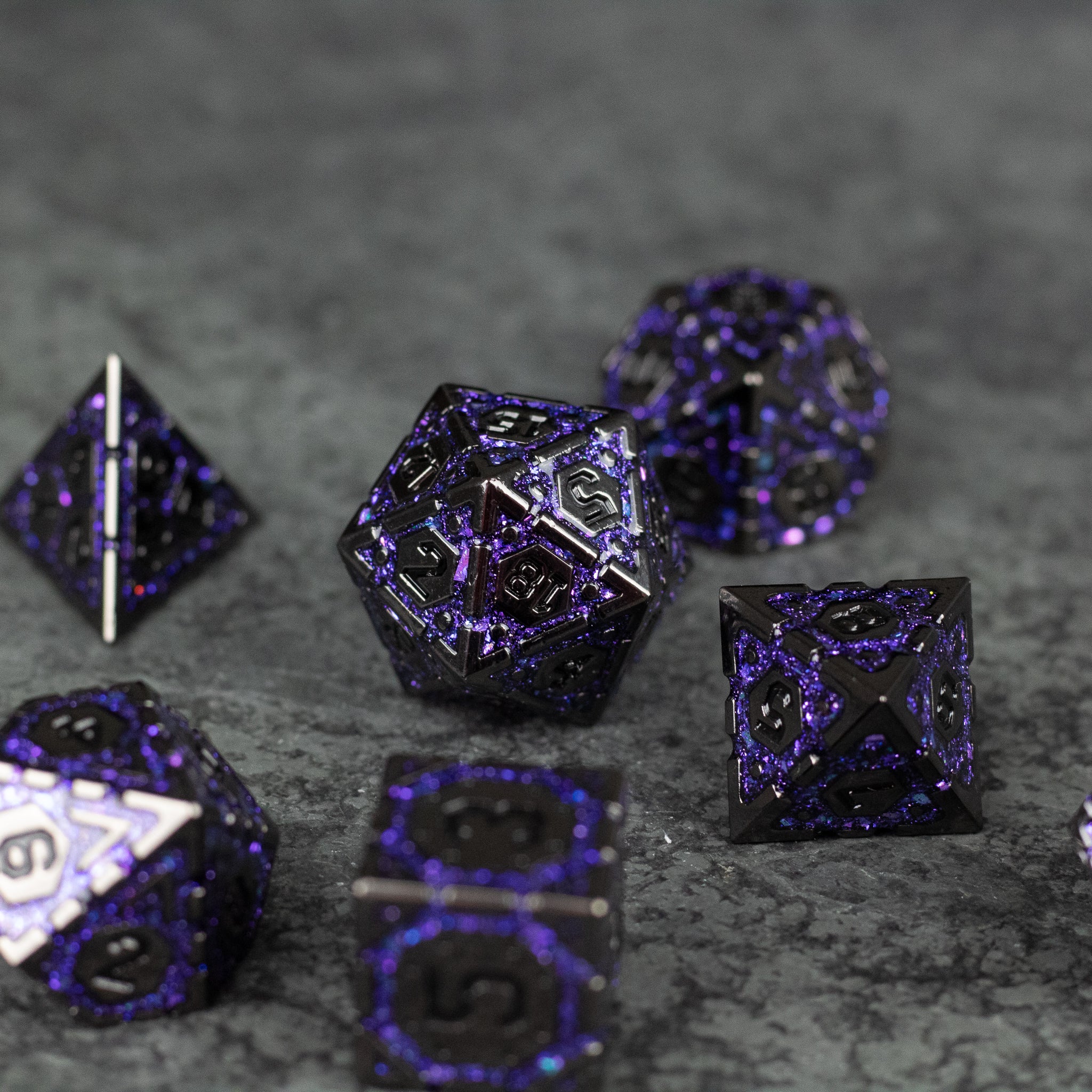 Purple Arcane Ward Dice Set - Set of seven purple and black metal polyhedral dice with arcane-inspired designs and intricate glyphs.