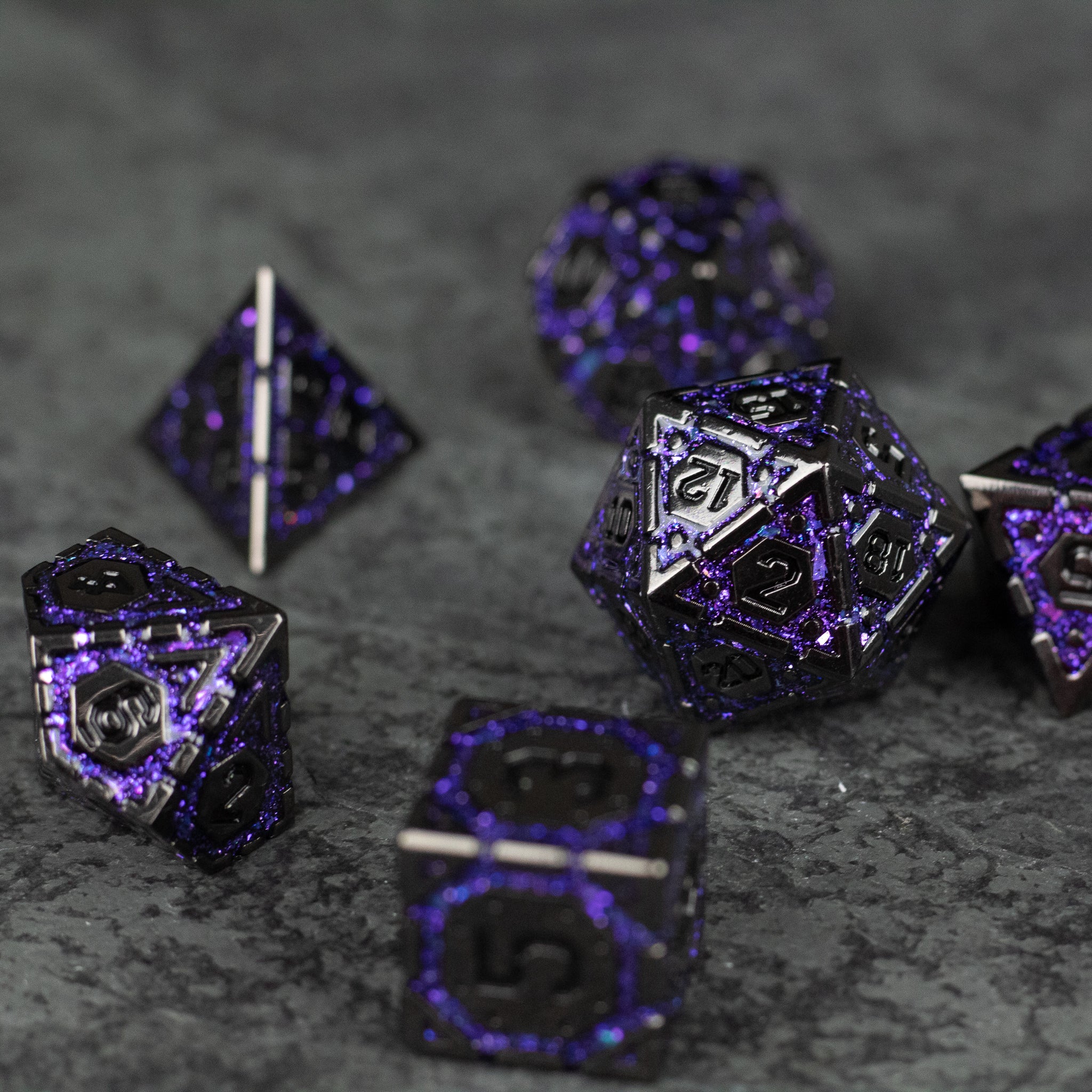 Purple Arcane Ward Dice Set - Set of metal gaming dice with purple and black arcane-themed designs, featuring various polyhedral shapes including d20,.