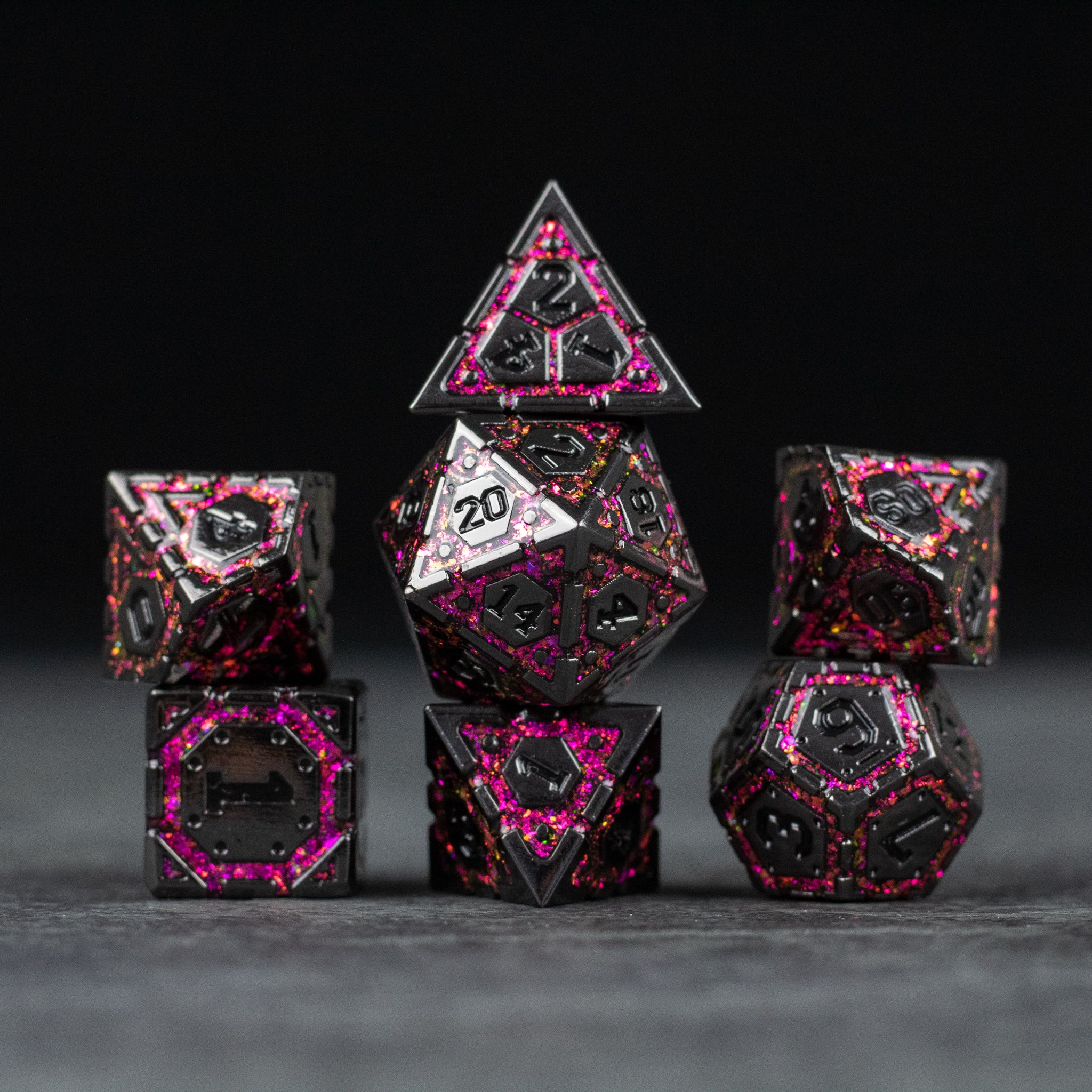 Pink Arcane Ward - Black metal polyhedral dice set with pink arcane symbols and glowing edges, including d20, d12, d10, d8, d6, and d4.