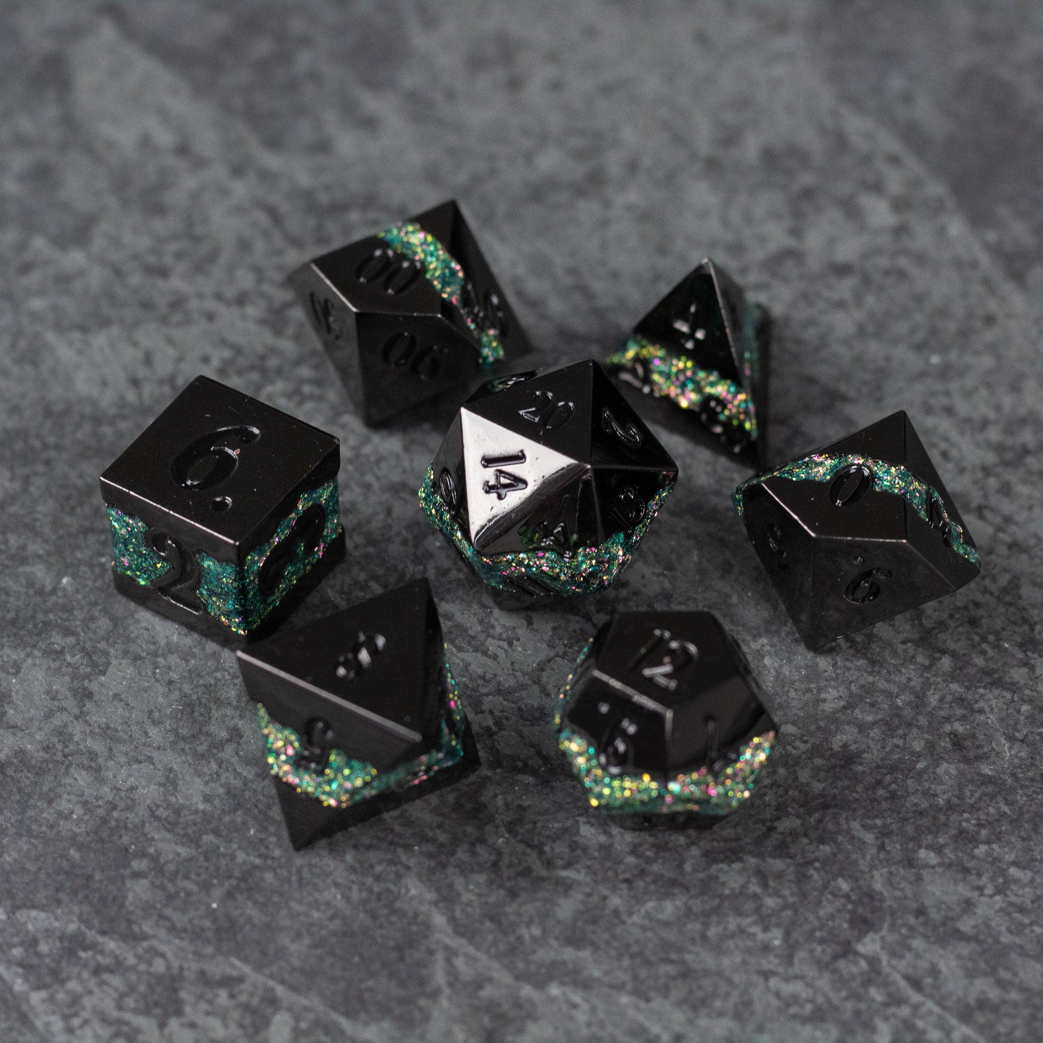 Light Green Rift Dice Set - Black metal polyhedral dice set with light green and iridescent glitter accents on dark gray background.