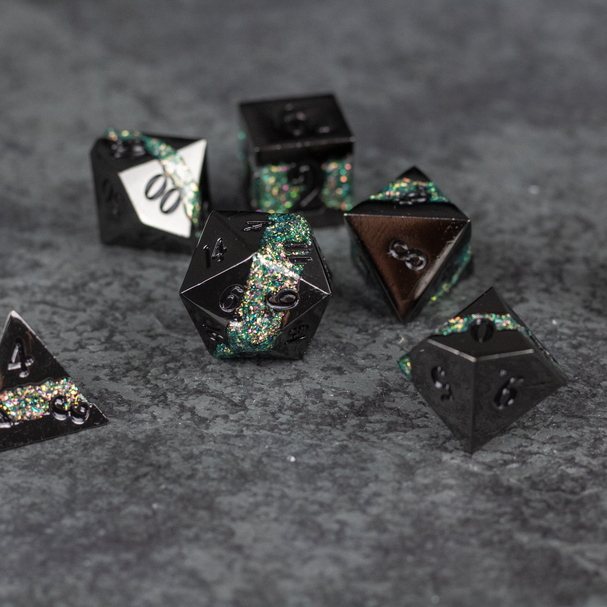Light Green Rift Dice Set - Black metal dice set with light green iridescent rift patterns, various polygon shapes.