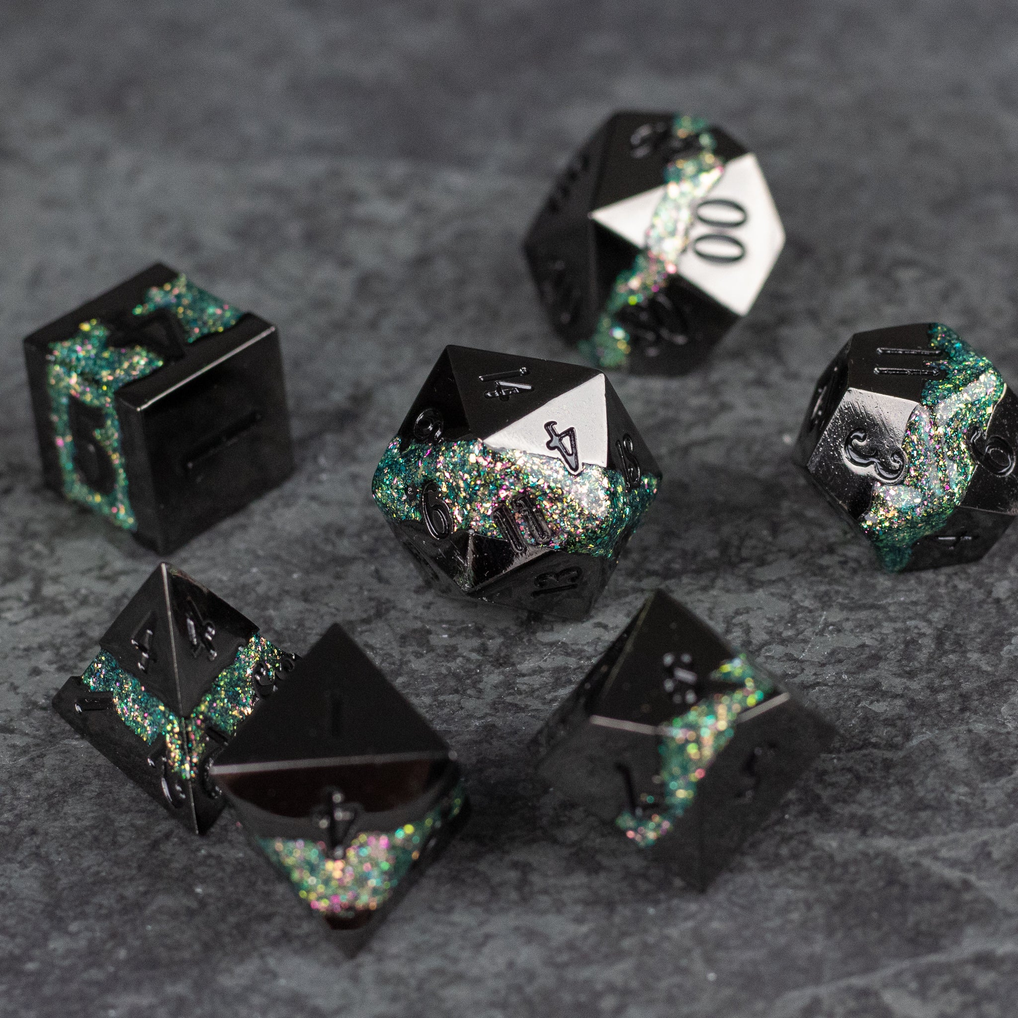 Light Green Rift Dice Set - Set of seven black metal dice with light green and silver glitter accents, various polyhedral shapes.