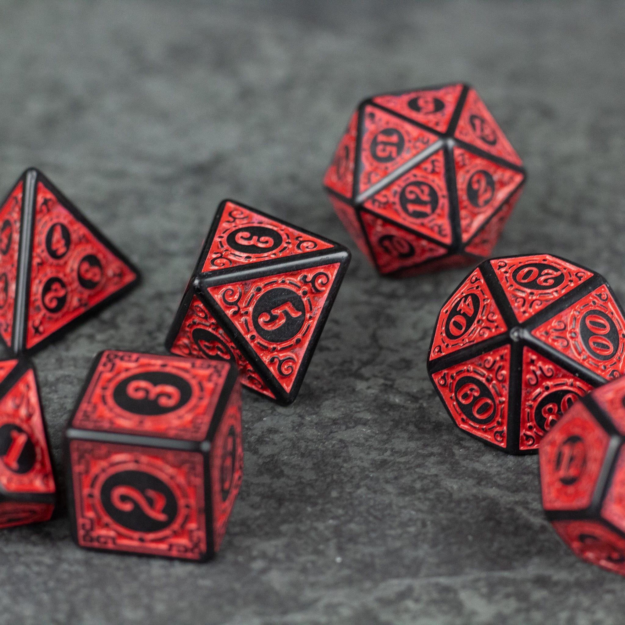 Red Runes Acrylic Dice Set - Set of red acrylic polyhedral dice with black etched runic numbers, textured surface, and translucent finish.