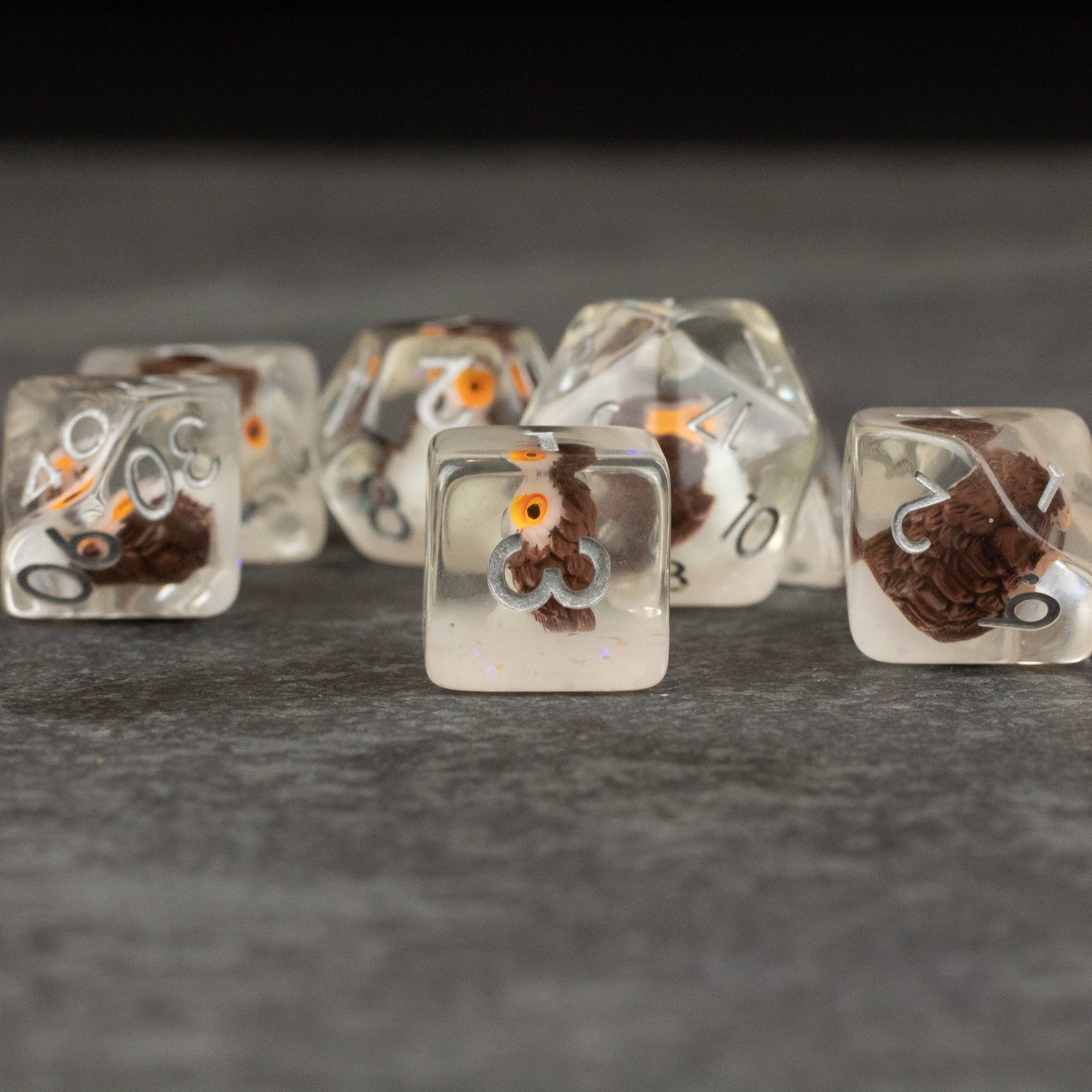 Owl Dice Set - Transparent polyhedral dice set with small detailed owl figurines inside and white numbers.