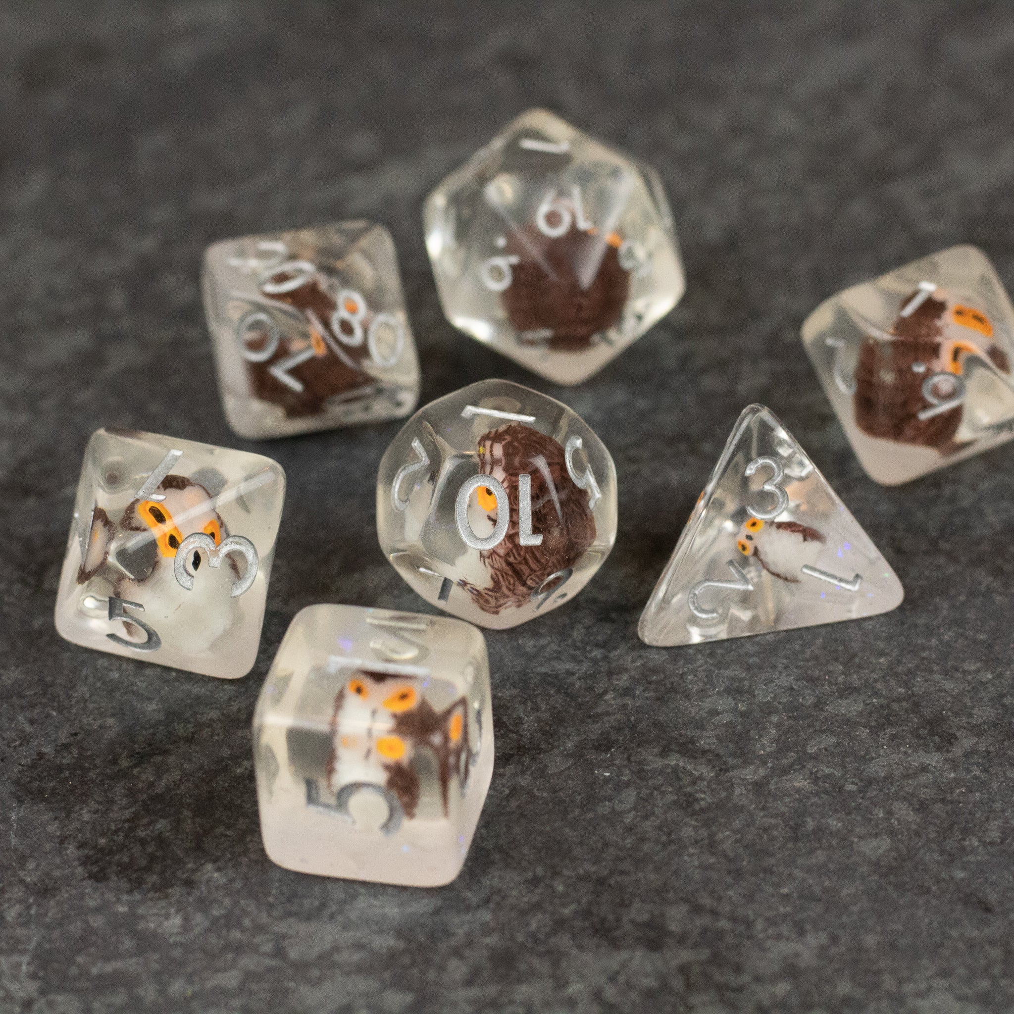 Owl Dice Set - Clear polyhedral dice set with tiny owl figurines inside, white numbering, various shapes.