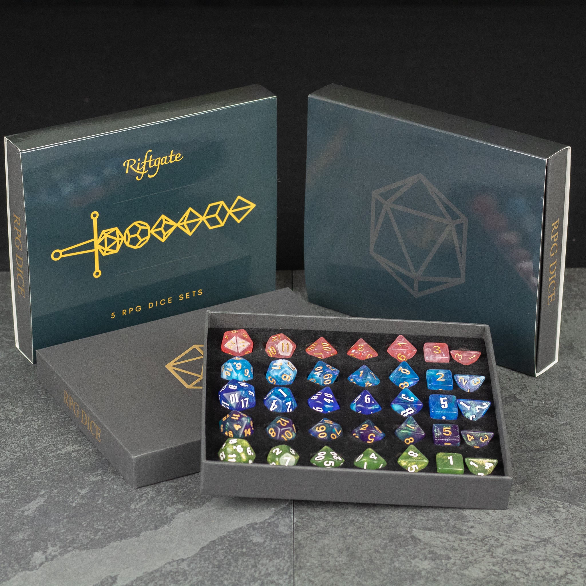 Acrylic Dice Set Gift Box - Set of colorful acrylic polyhedral dice in a black gift box with geometric and sword design lids.