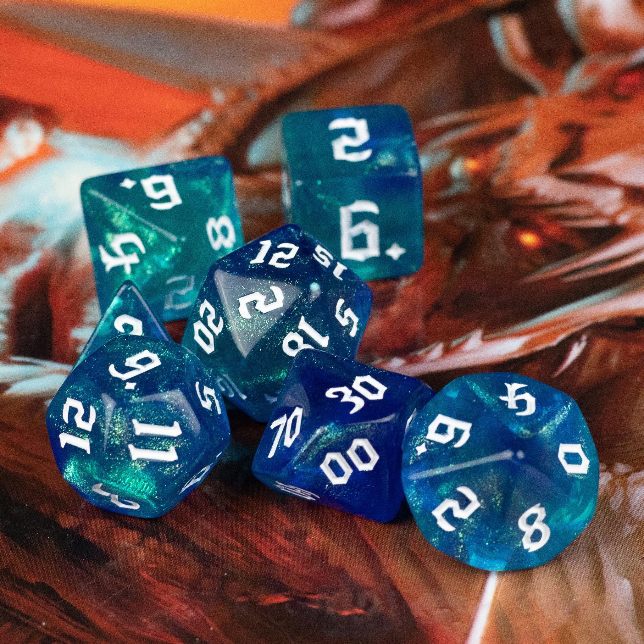 Blue & Green Glitter Dice Set - Set of six blue and green glittery polyhedral dice with white numbering, designed for tabletop gaming.