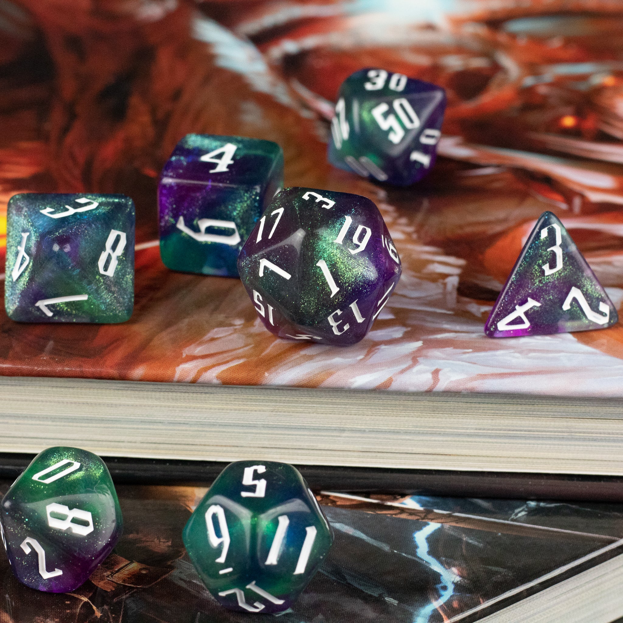 Purple & Green Glitter Dice Set - Purple and green glittery polyhedral dice set with white numbering on various shapes including d20, d12, d10, d8, d6, and d4.