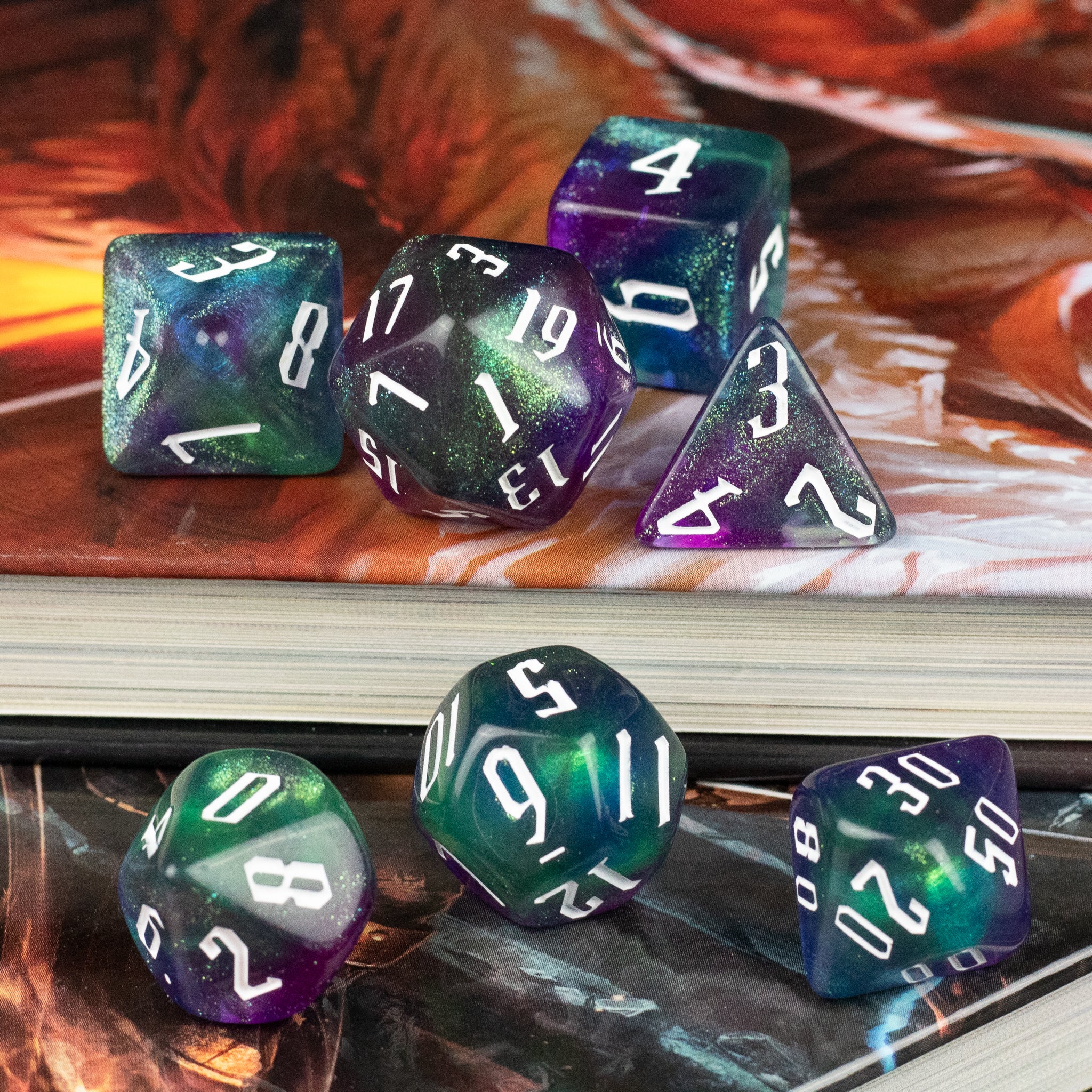 Purple & Green Glitter Dice Set - Purple and green glittery polyhedral dice set with white numbering, including d20, d12, d10, d8, d6, and d4 shapes.