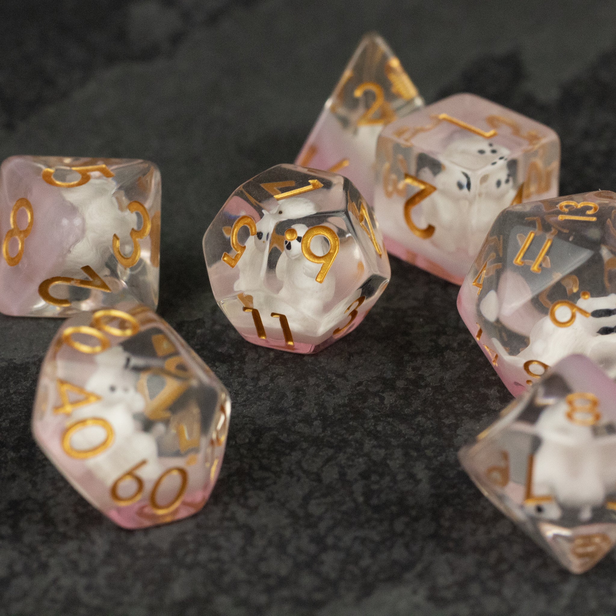 Polar Bear Dice Set - Transparent polyhedral dice set with tiny white polar bears inside and gold numbers.