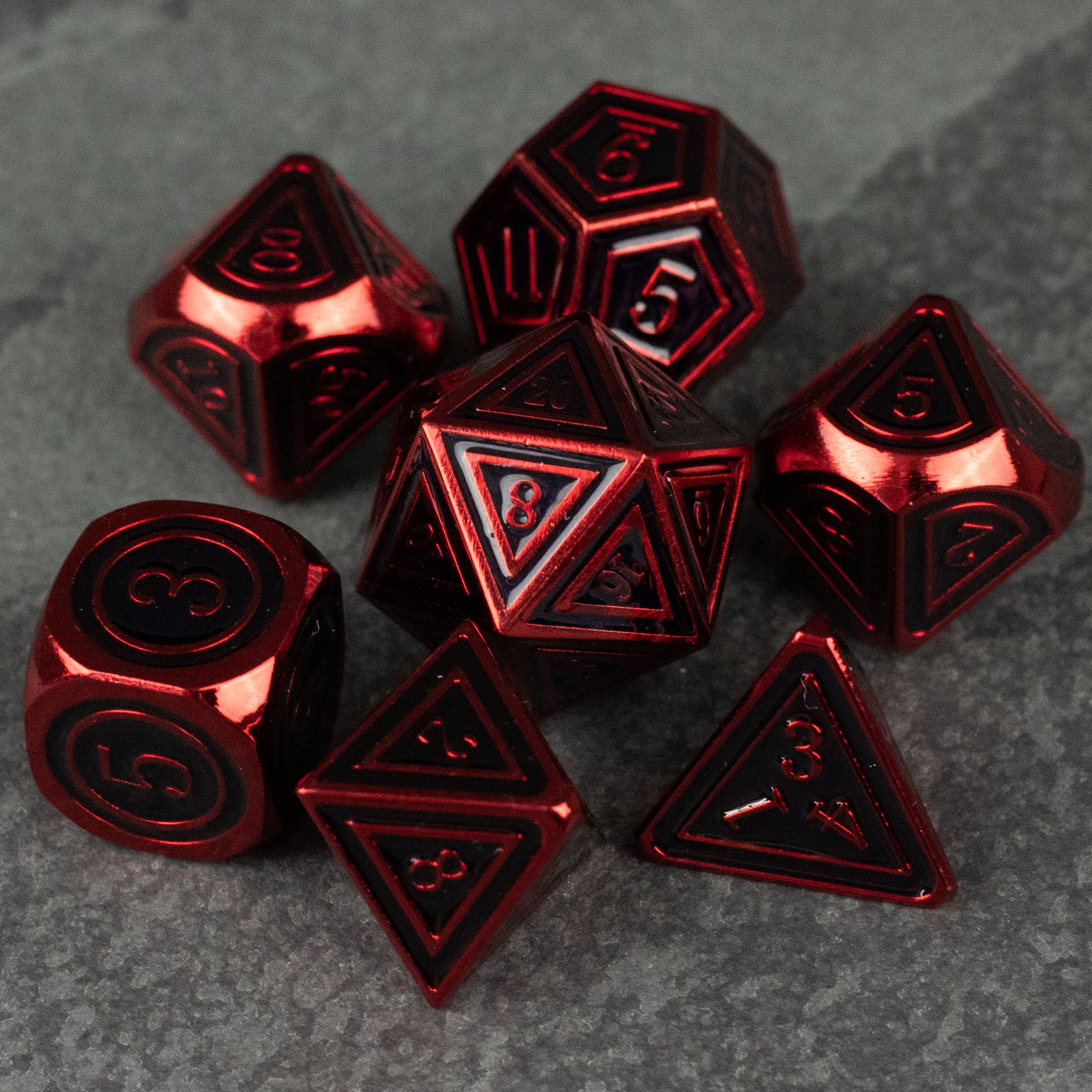 Crimson Ritual Dice Set - Set of eight red metallic polyhedral dice with black engraved numbers, including d20, d12, d10, d8, d6, and d4 shapes.
