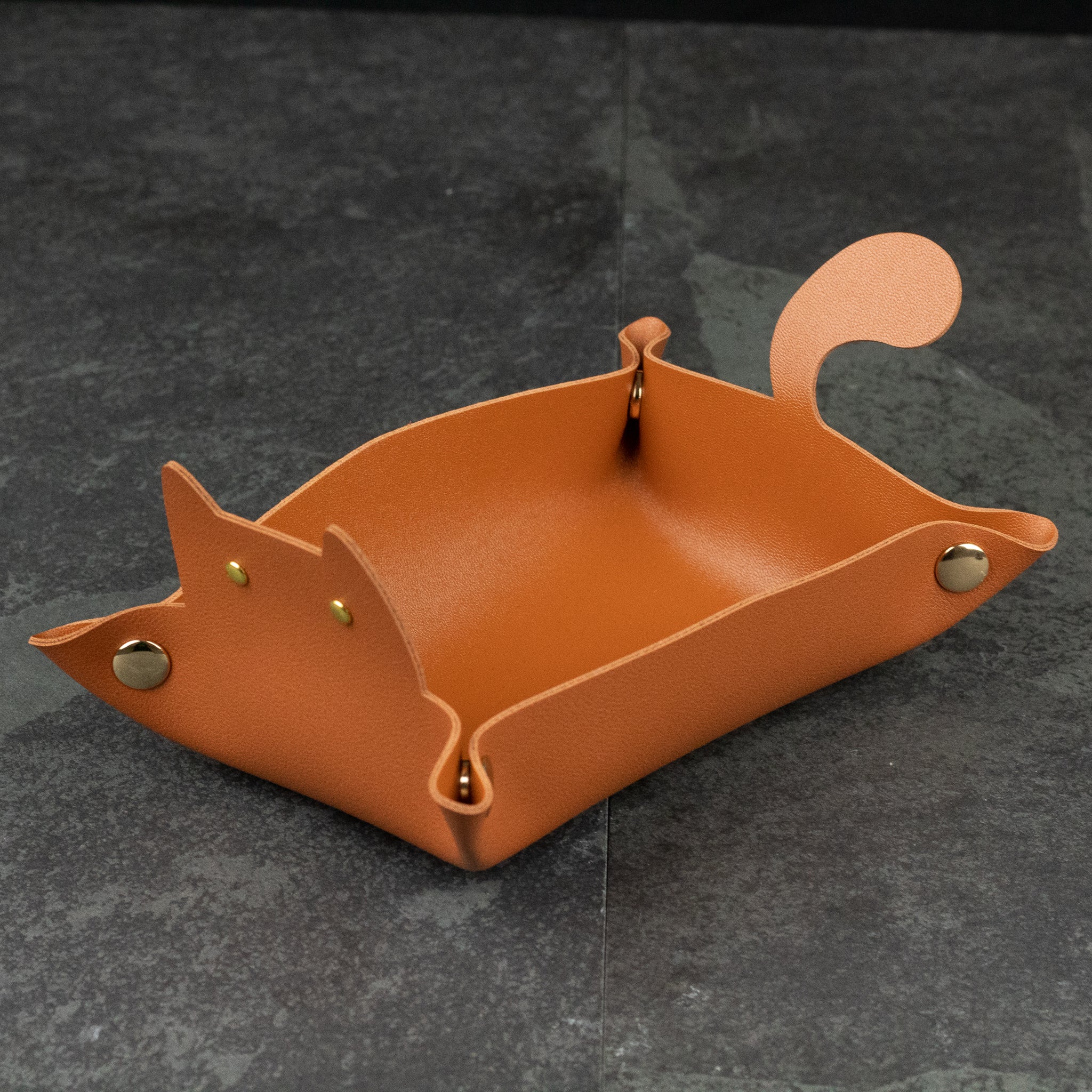 Cat Shaped Dice Tray - Tan leather dice tray shaped like a cat with gold snap buttons and a raised tail.