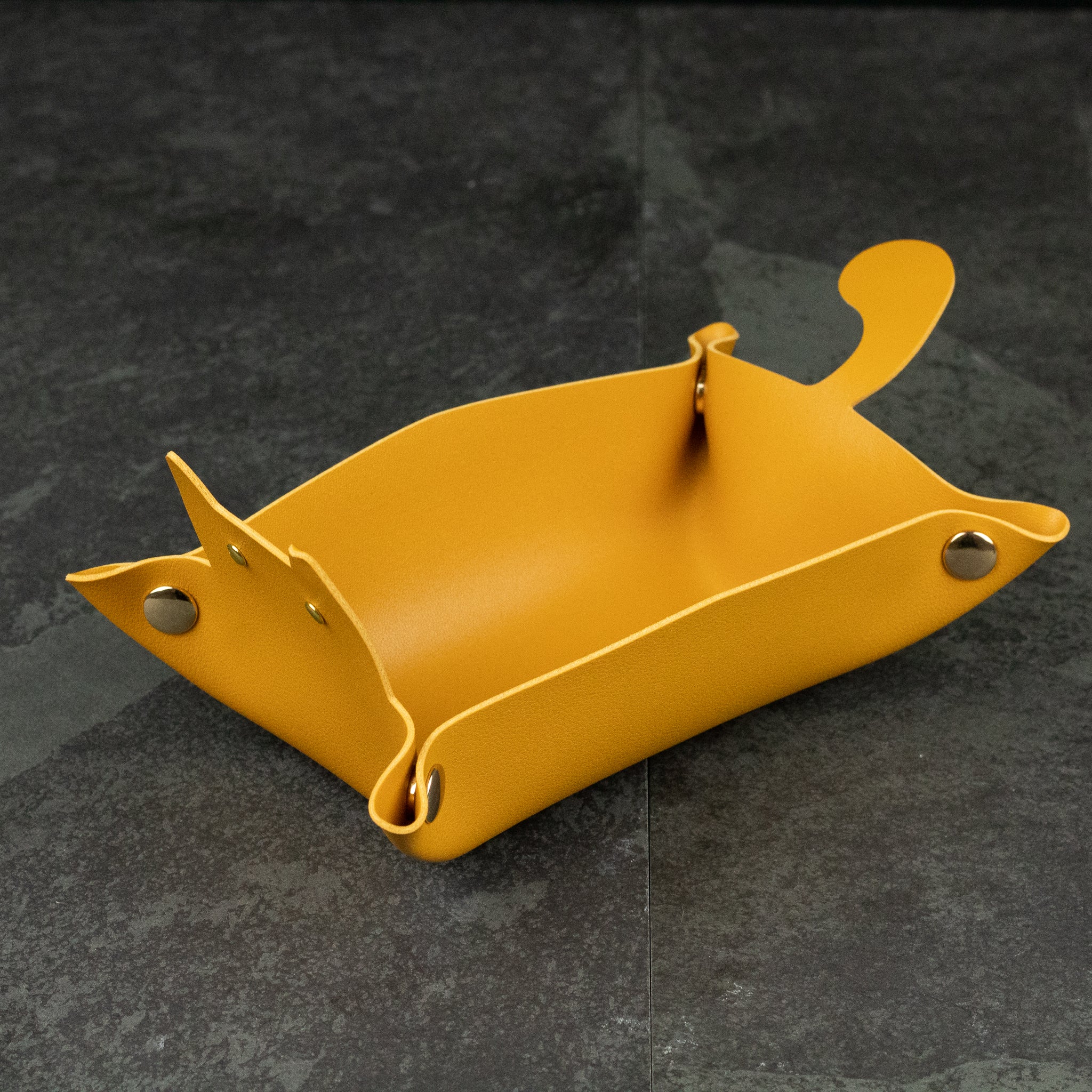Cat Shaped Dice Tray - Mustard yellow leather dice tray shaped like a cat with pointed ears and curled tail.