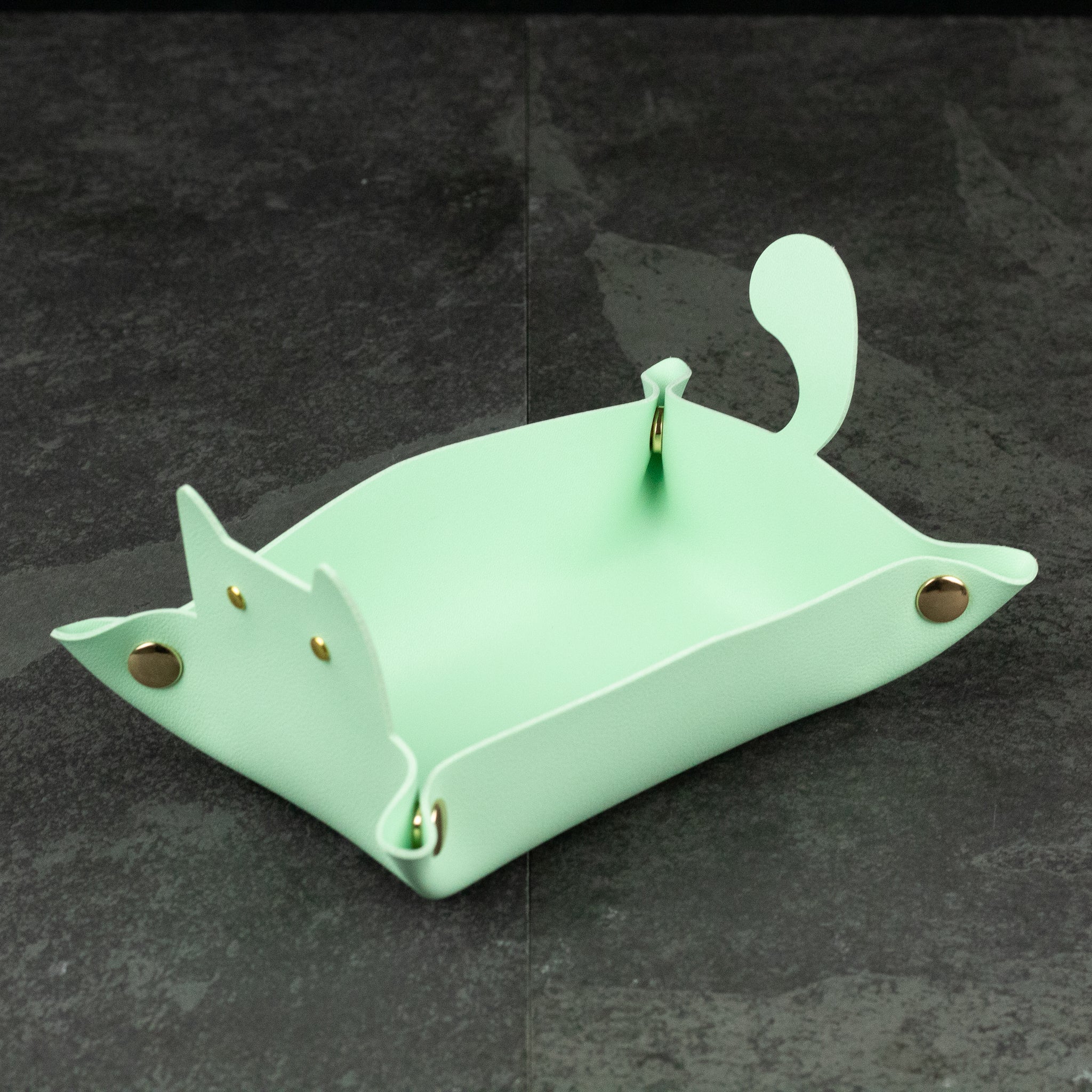 Cat Shaped Dice Tray - Mint green leather dice tray shaped like a cat with pointed ears and curved tail.