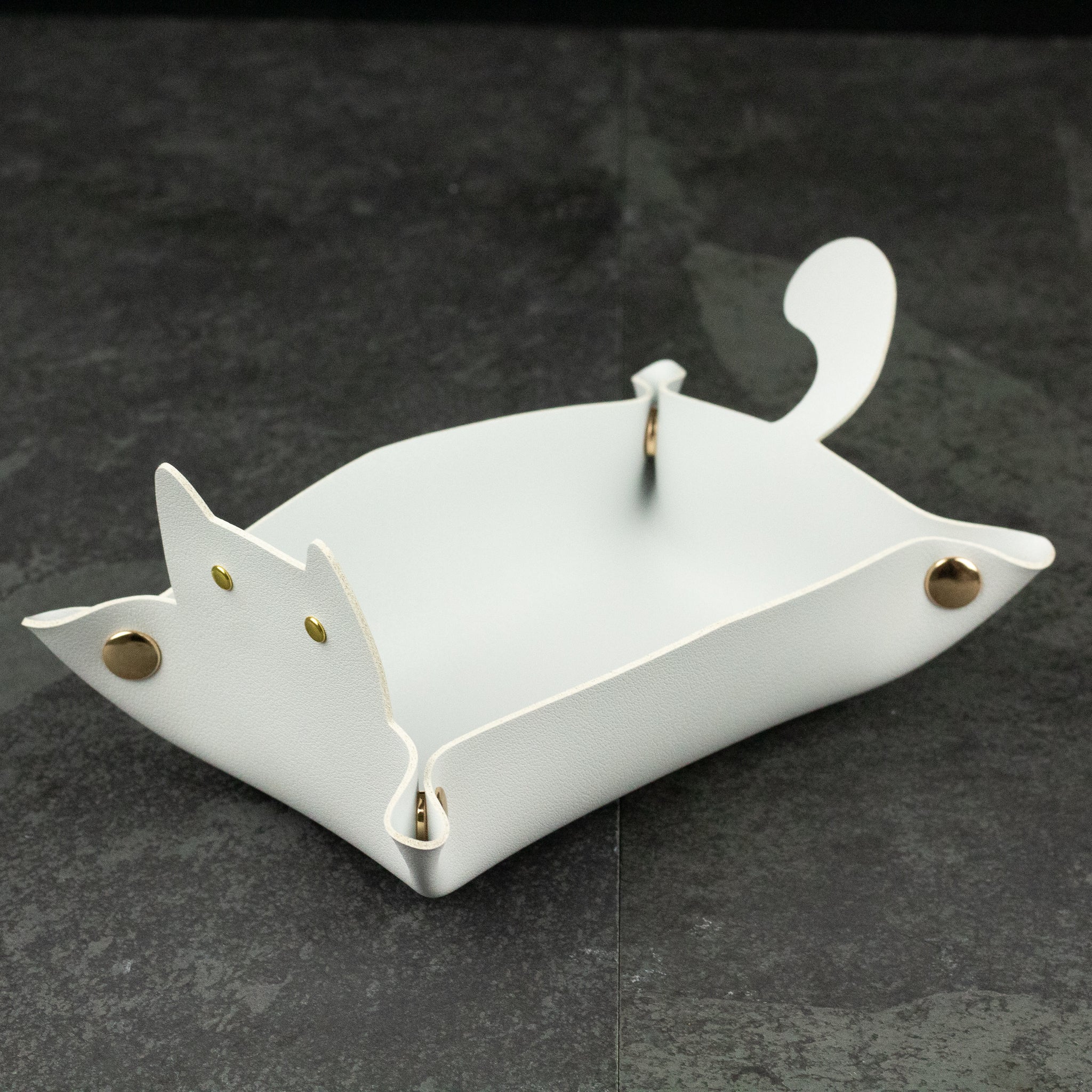 Cat Shaped Dice Tray - White leather dice tray shaped like a cat with pointed ears and curved tail, secured with metal studs.