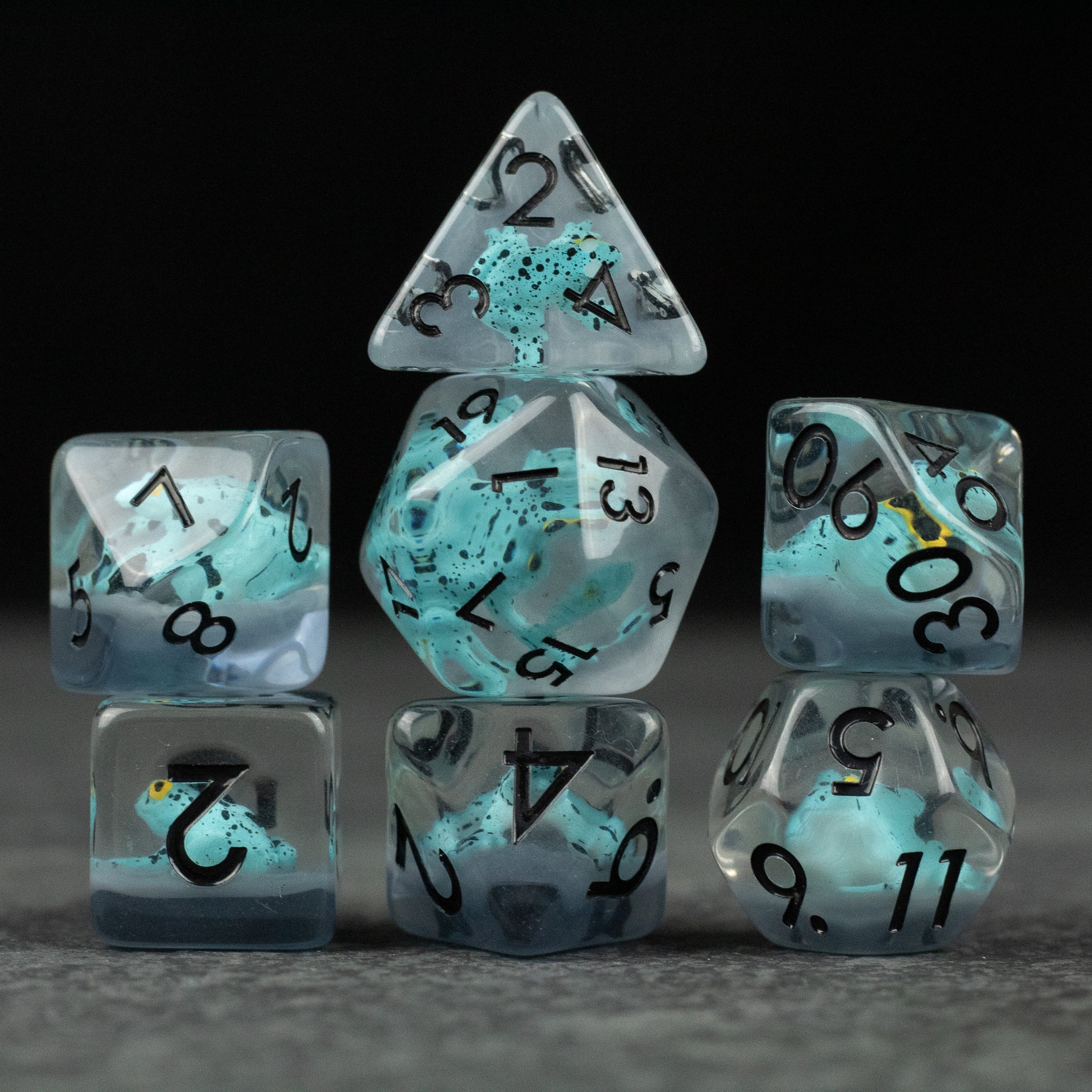 Blue Frog Dice Set - Translucent blue and clear polyhedral dice set with black numbers, featuring a mix of standard shapes including d20, d12,.