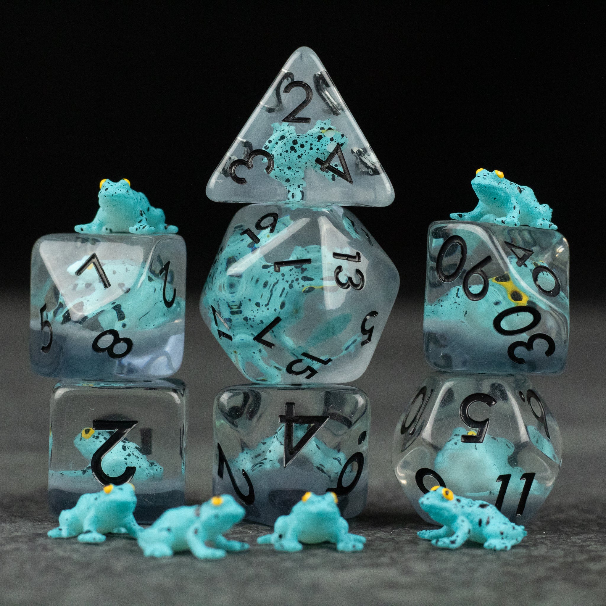 Blue Frog Dice Set - Translucent dice set with teal-blue frogs inside each die, black numbering, includes various polyhedral shapes including.