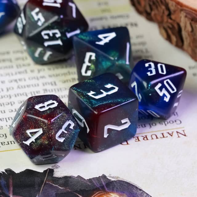 Dark Rainbow Glitter Dice Set - Dark glittery polyhedral dice set with white numbering in deep blue, purple, and black tones.