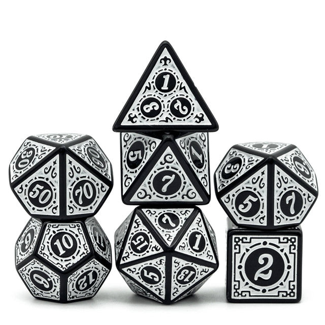 White Runes Acrylic Dice Set - Set of seven white acrylic polyhedral dice with black intricate rune-style markings and numbers.