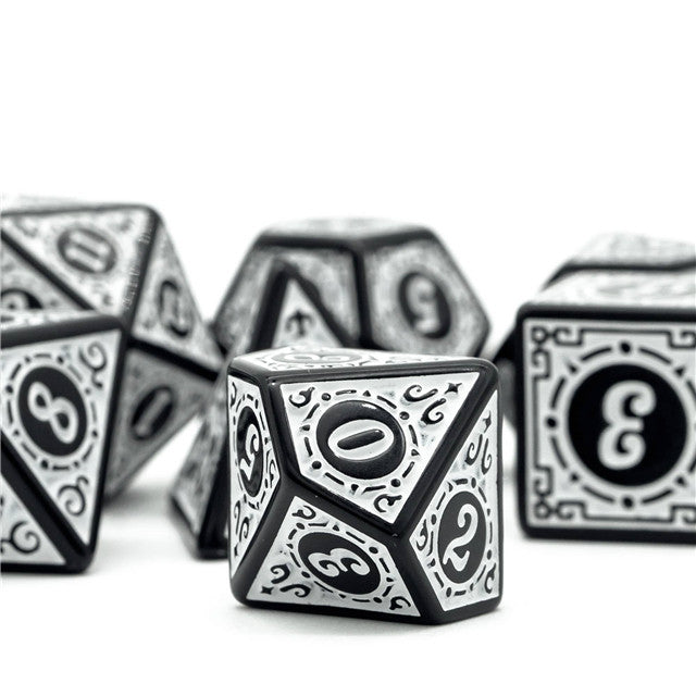 White Runes Acrylic Dice Set - White acrylic polyhedral dice set with black rune-style numbers and intricate border designs.