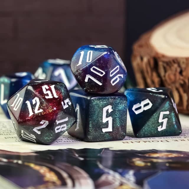 Dark Rainbow Glitter Dice Set - Dark multi-faceted dice set with rainbow glitter and white numbers, including d20, d12, d10, d8, d6, and d4 shapes.