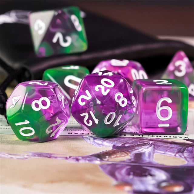 Purple & Green Transparent Dice - Set of translucent acrylic dice in purple and green with white numbering, including a twenty-sided die, an eight-sided die,.