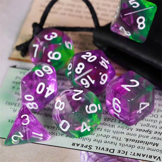 Purple & Green Transparent Dice - Set of purple and green transparent acrylic dice with white numbers and multiple shapes on a game board.