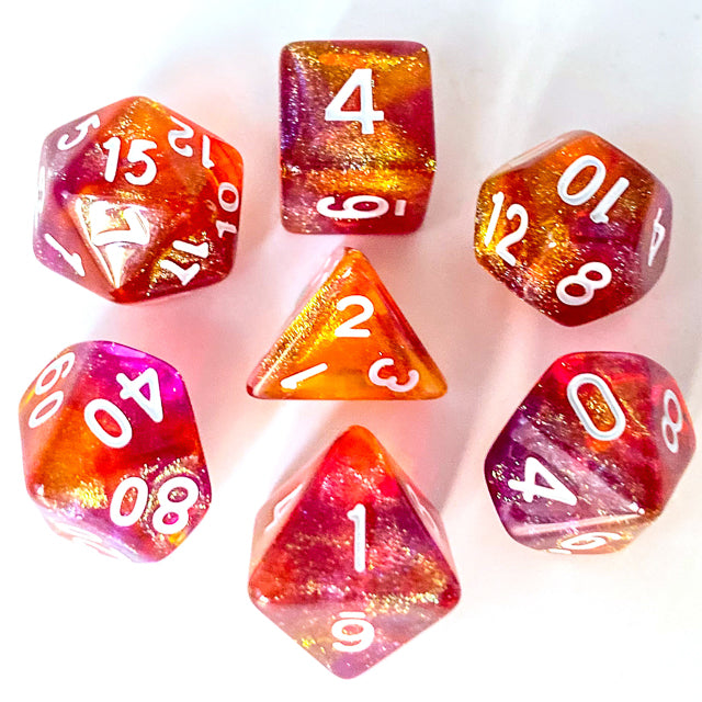 Sunset Glitter Acrylic Dice Set - Set of seven sunset gradient acrylic dice with glitter and white numbers, including d20, d12, d10, d8, d6, d4, and.