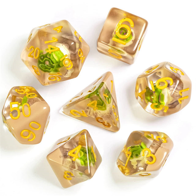 Succulent Dice Set - Translucent brown seven-piece dice set with tiny green succulents inside and yellow numbers.