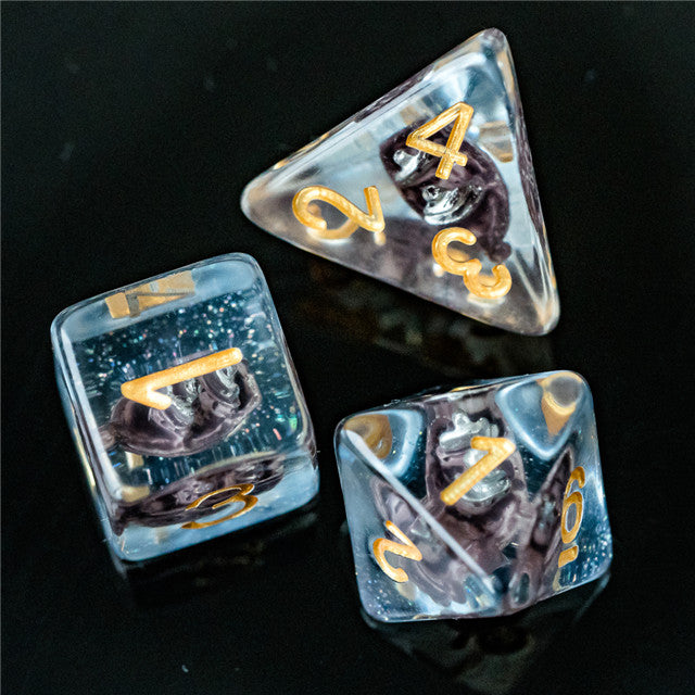 Boat Dice - Set of three translucent blue dice with gold numbers, featuring black and white boat illustrations inside.